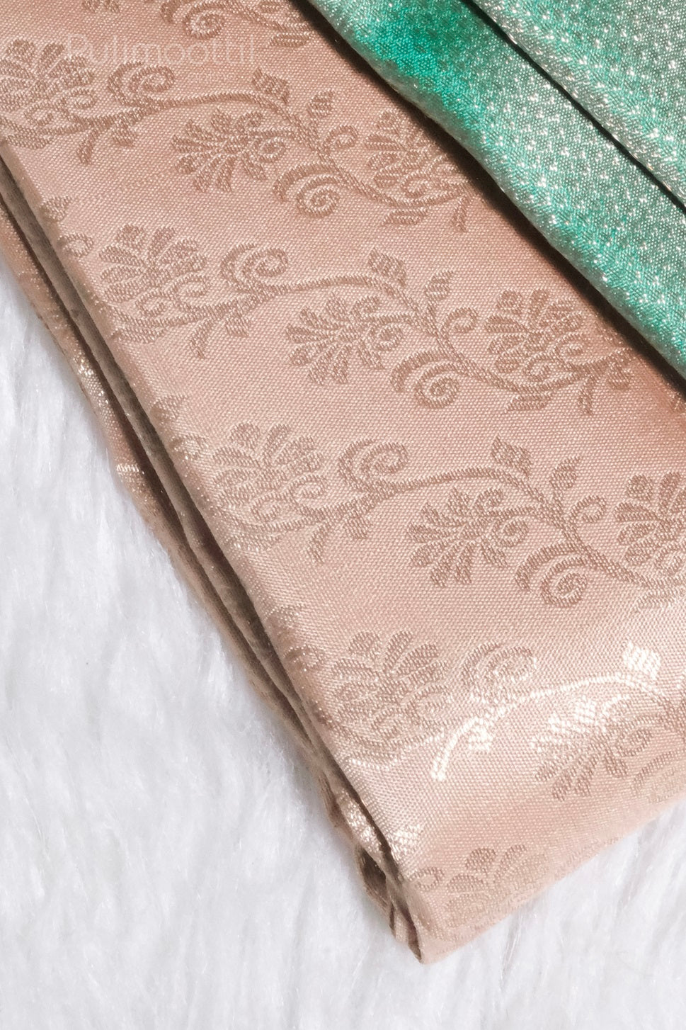ivory cream Kanchipuram brocade saree body with gold floral motifs and vibrant jungle green brocade border