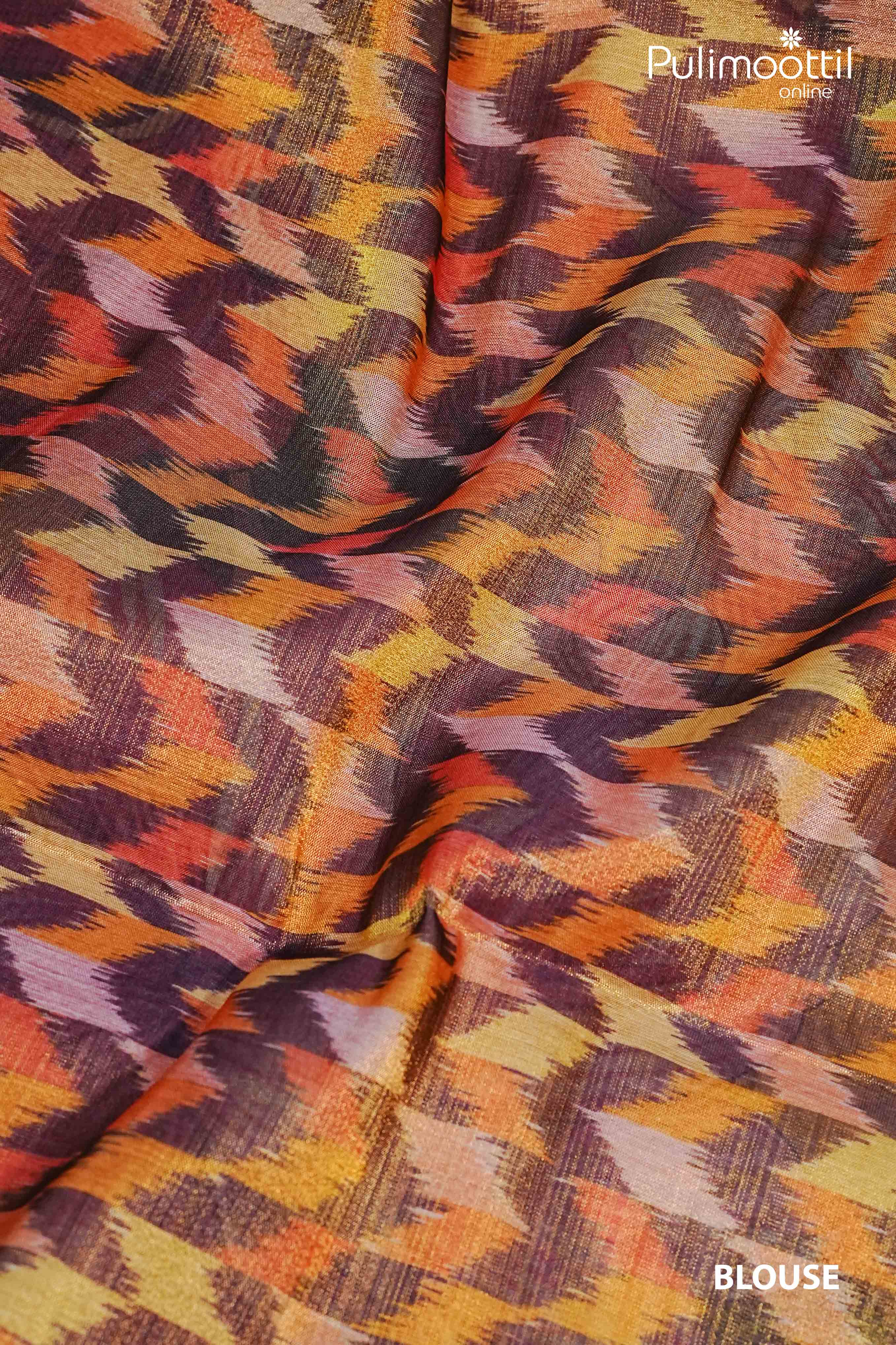 Multicolour abstract printed blouse fabric in maroon, mustard, orange, and plum shades – paired with golden yellow Kerala tissue saree.