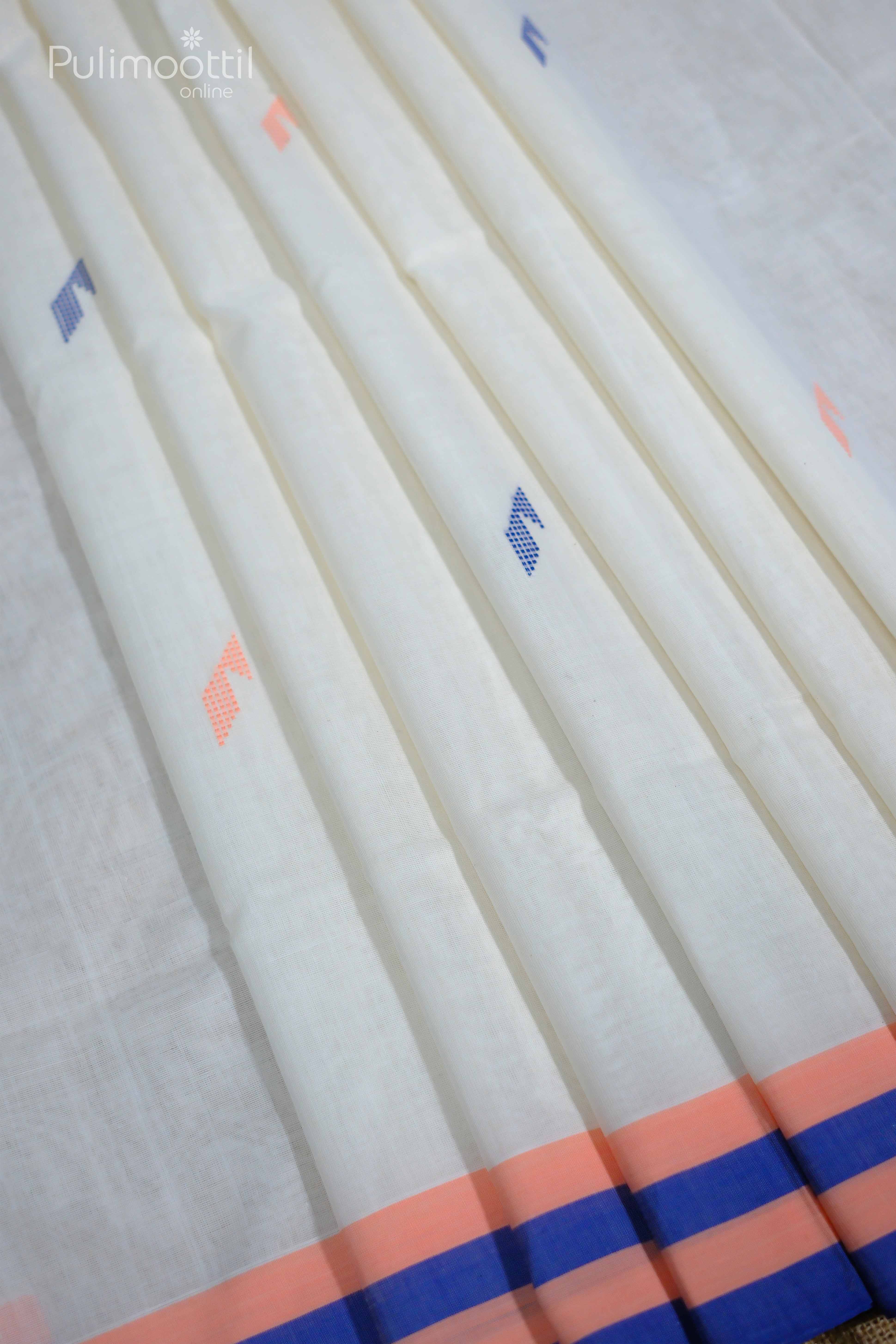 “Pleats of a cream‑white Kerala saree with scattered peach and blue mixed‑thread motifs, featuring a peach and deep‑blue striped border, draped to highlight its fine cotton weave.