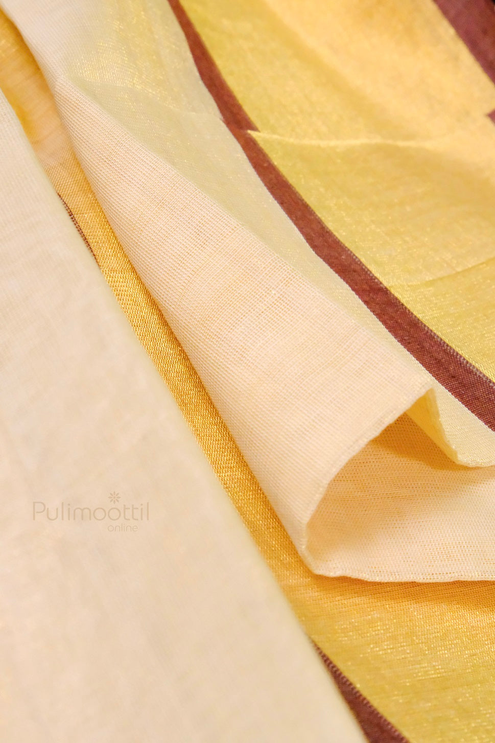 Close-up of a traditional off-white Kerala saree with golden and maroon borders, showcasing the fabric's texture and fine weave.