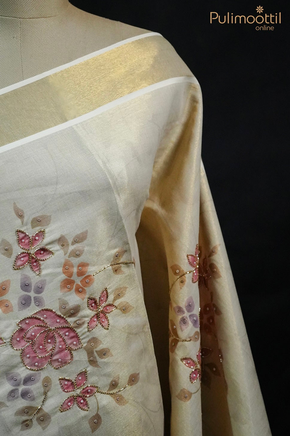 Close side view of Kerala traditional tissue saree on mannequin, featuring golden border and floral printed body with beads and sequence work – Onam Kerala saree.