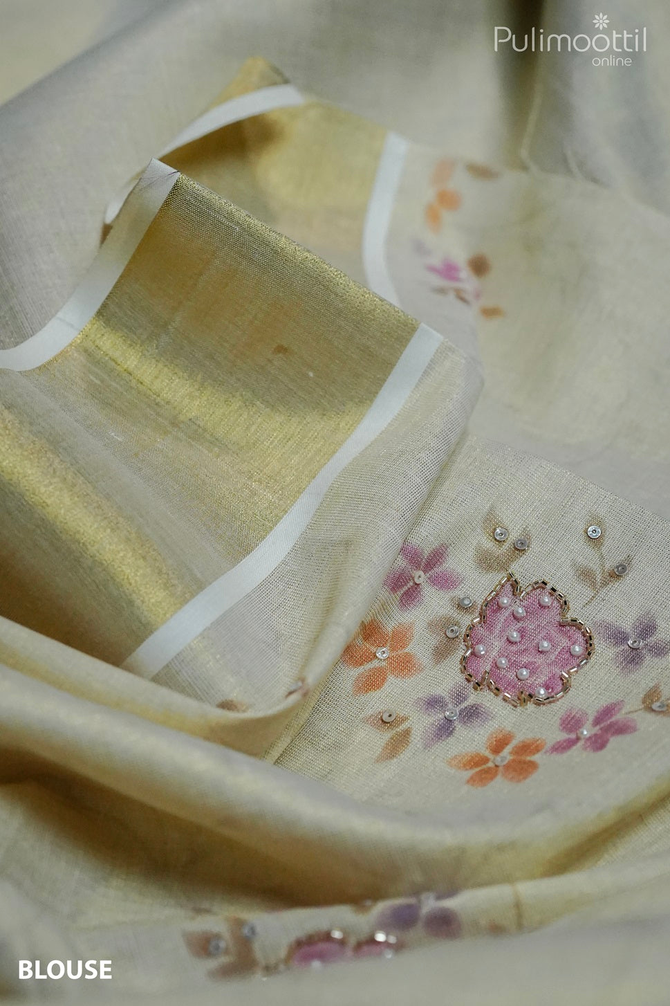 Blouse piece of Kerala tissue saree with golden border, floral print and bead sequence detailing – elegant Onam Kerala saree blouse design.