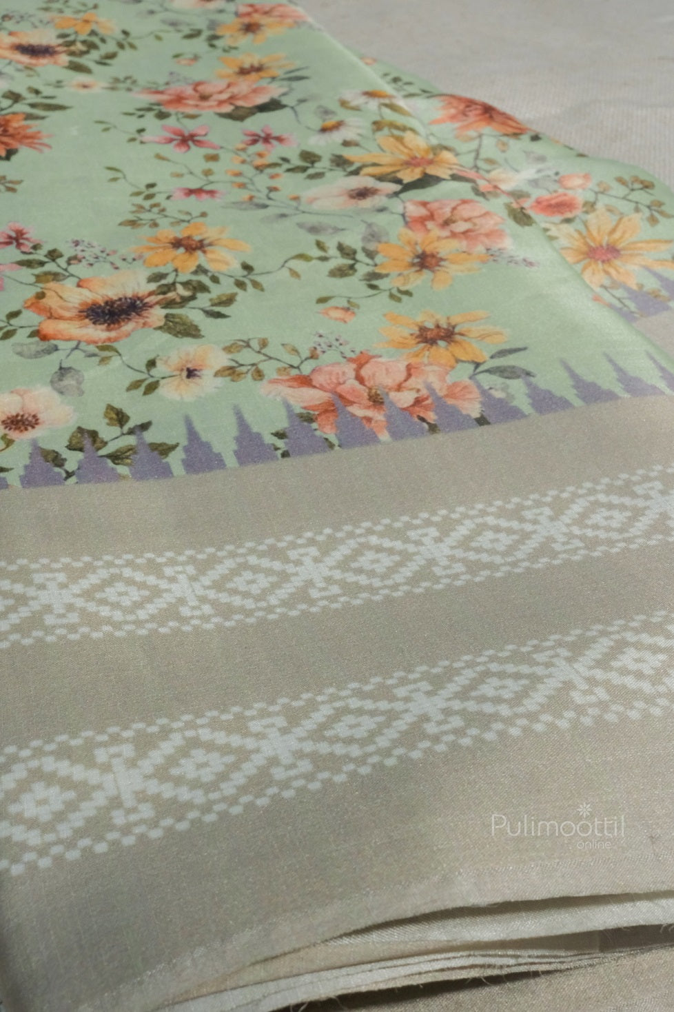 Close-up image of semi-soft silk saree with focus on zari border and woven pattern. Light cyan fabric with minimalistic elegance.