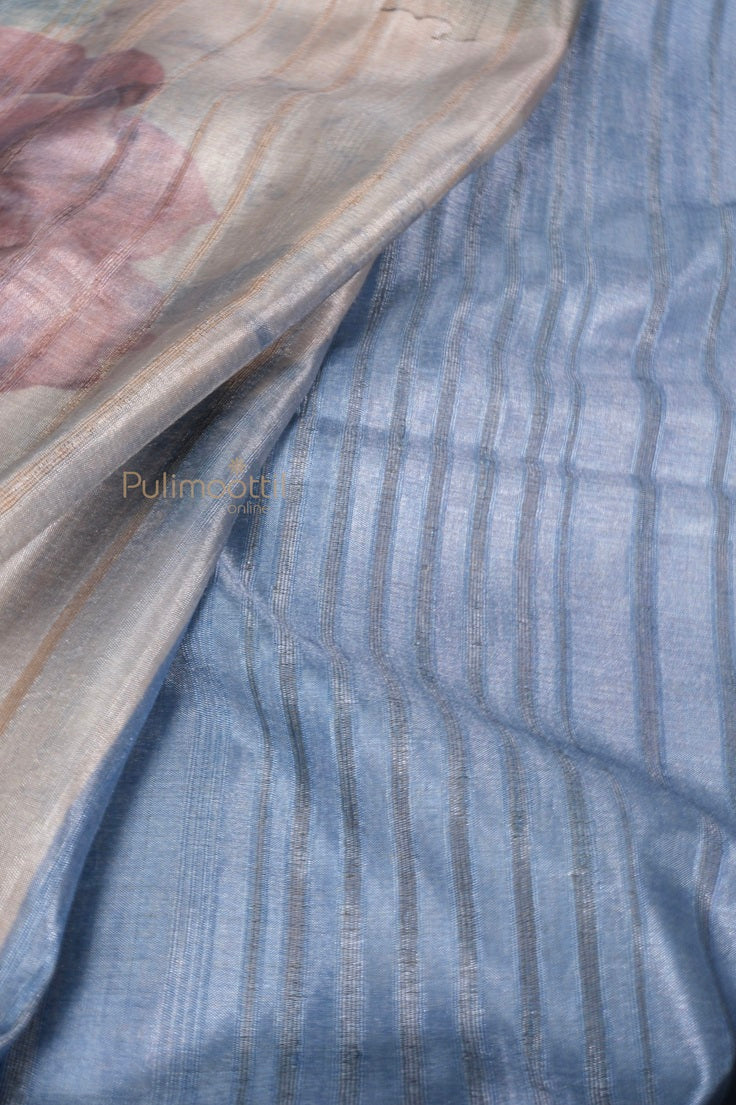 Detailed shot of blue pallu with vertical woven stripes on light gray and blue semi Tussar silk saree.