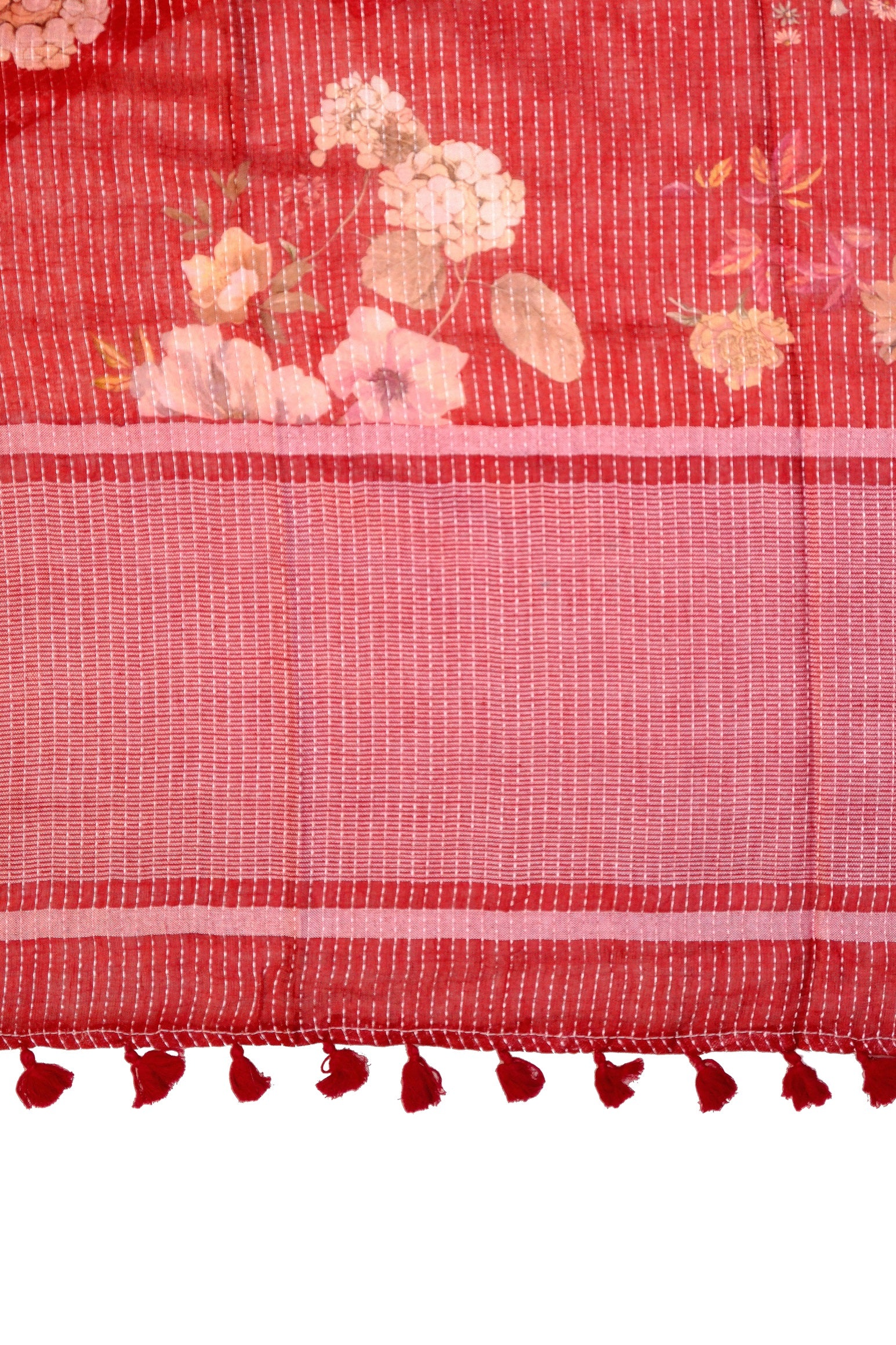 Close-up of floral pallu in red linen printed saree with tassels
