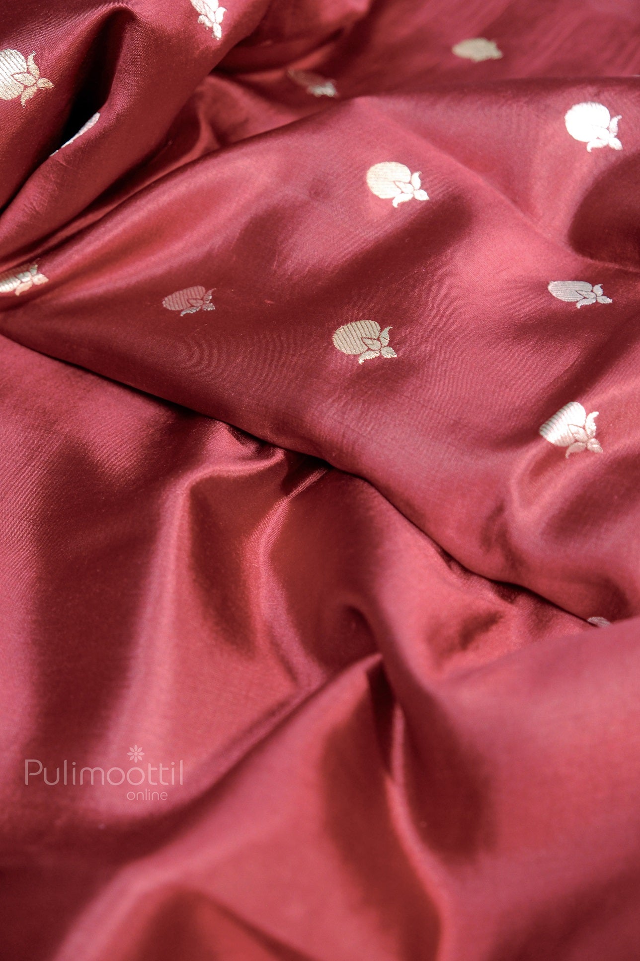 Elegant maroon Kerala silk saree with delicate gold butta motifs – traditional powerloom saree ideal for festivals and weddings