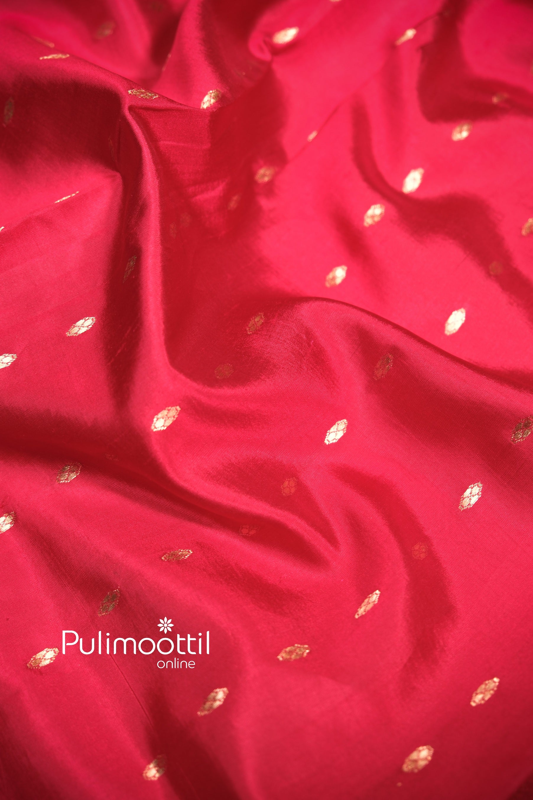 Maroon mango silk blouse piece with small, repetitive gold zari motifs, designed to perfectly match the saree’s traditional elegance.