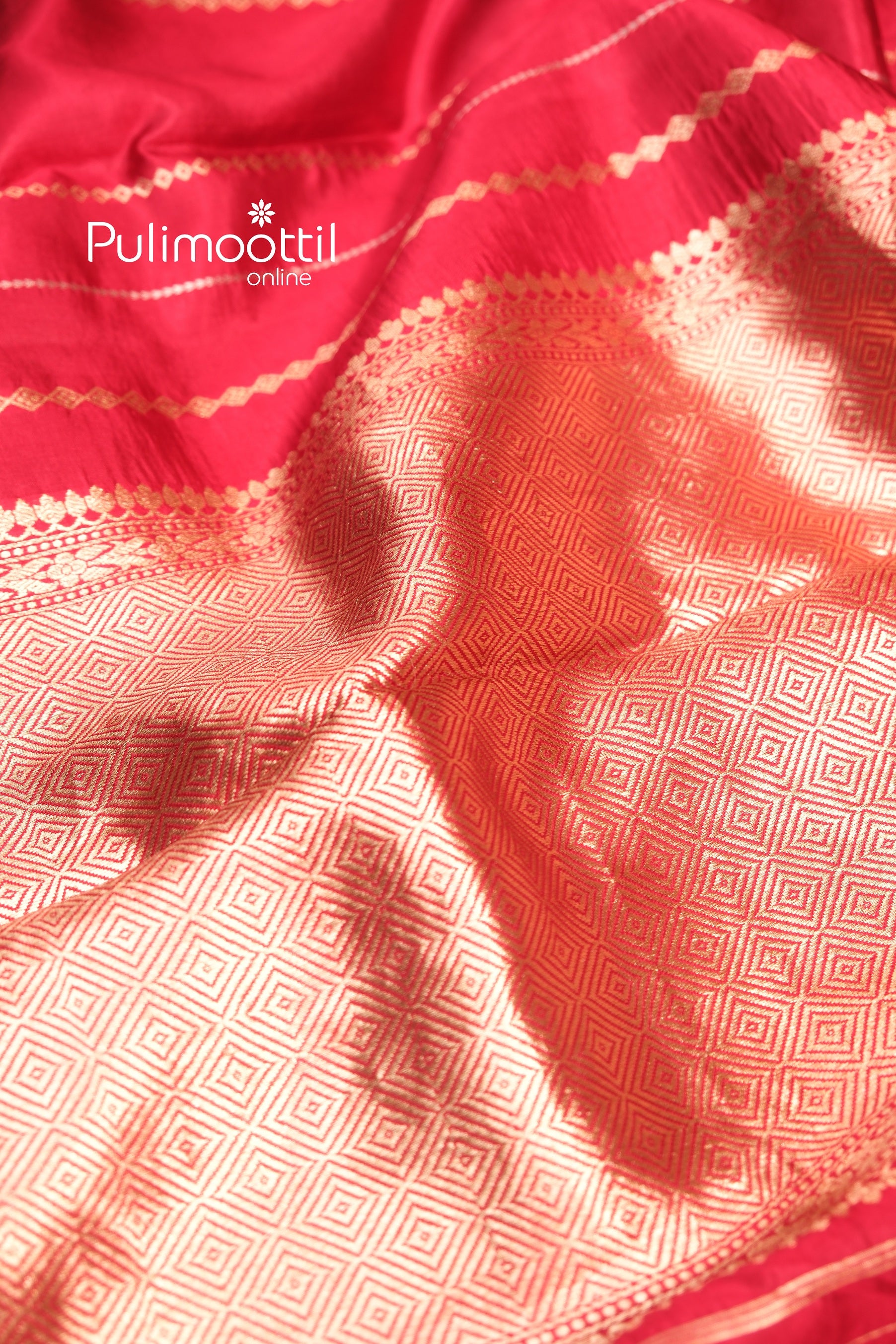 Alternate view of the maroon mango silk saree pallu emphasizing the dense and luxurious golden zari work with symmetrical diamond weaving.