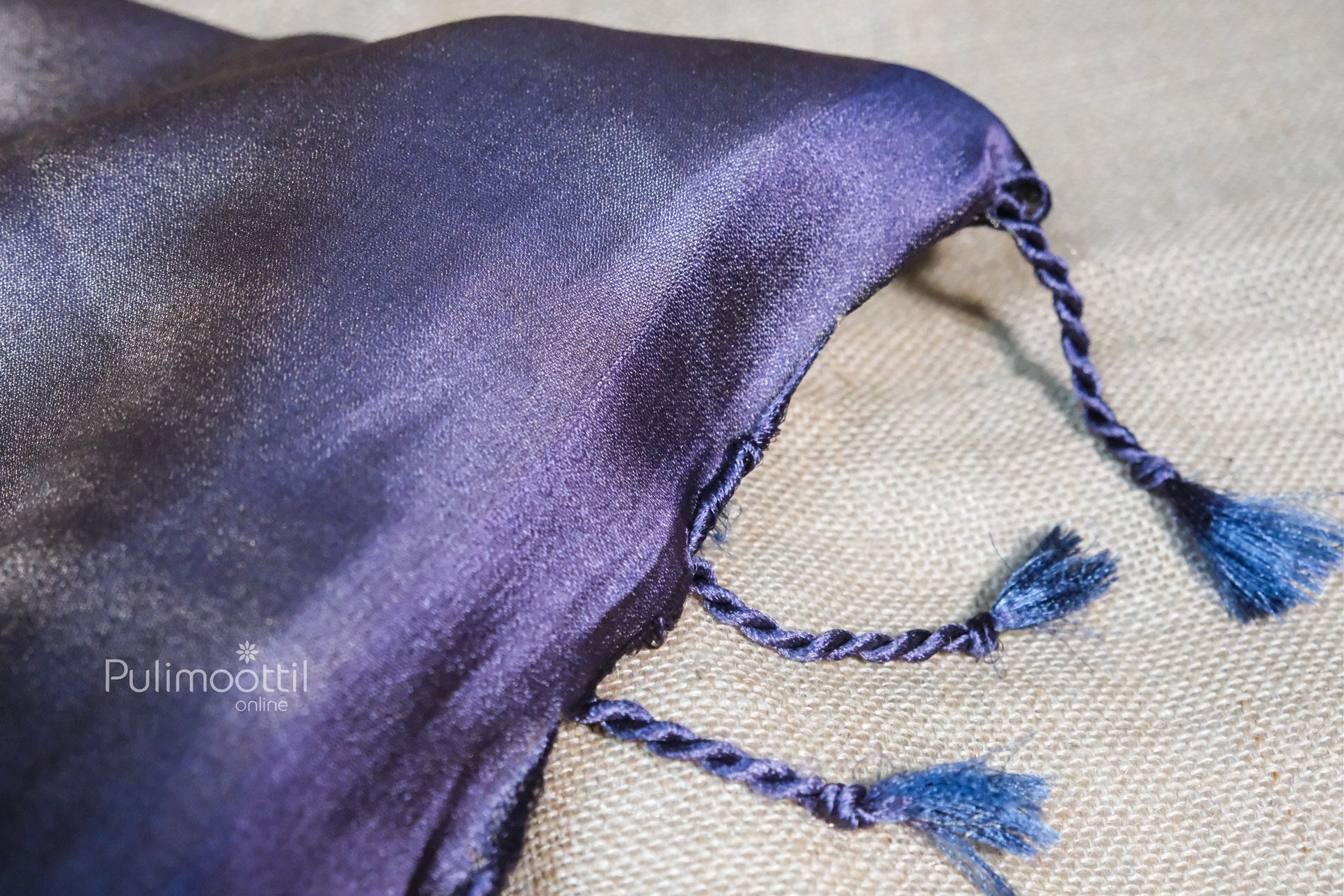showing tessels of violet saree