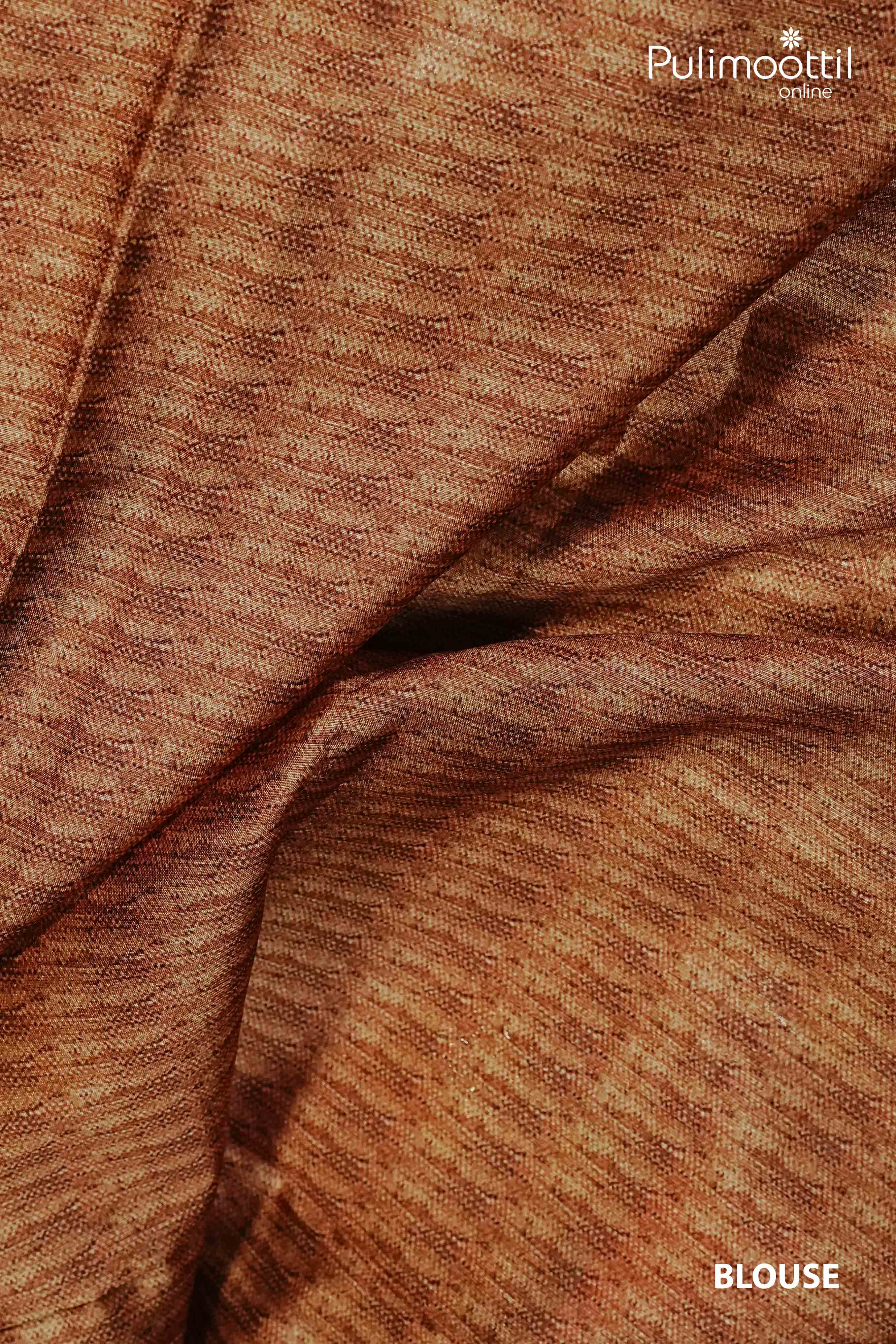Close-up of matching blouse piece fabric in golden-brown tone with textured weave, part of multi colour semi jute saree from Pulimoottil Online.