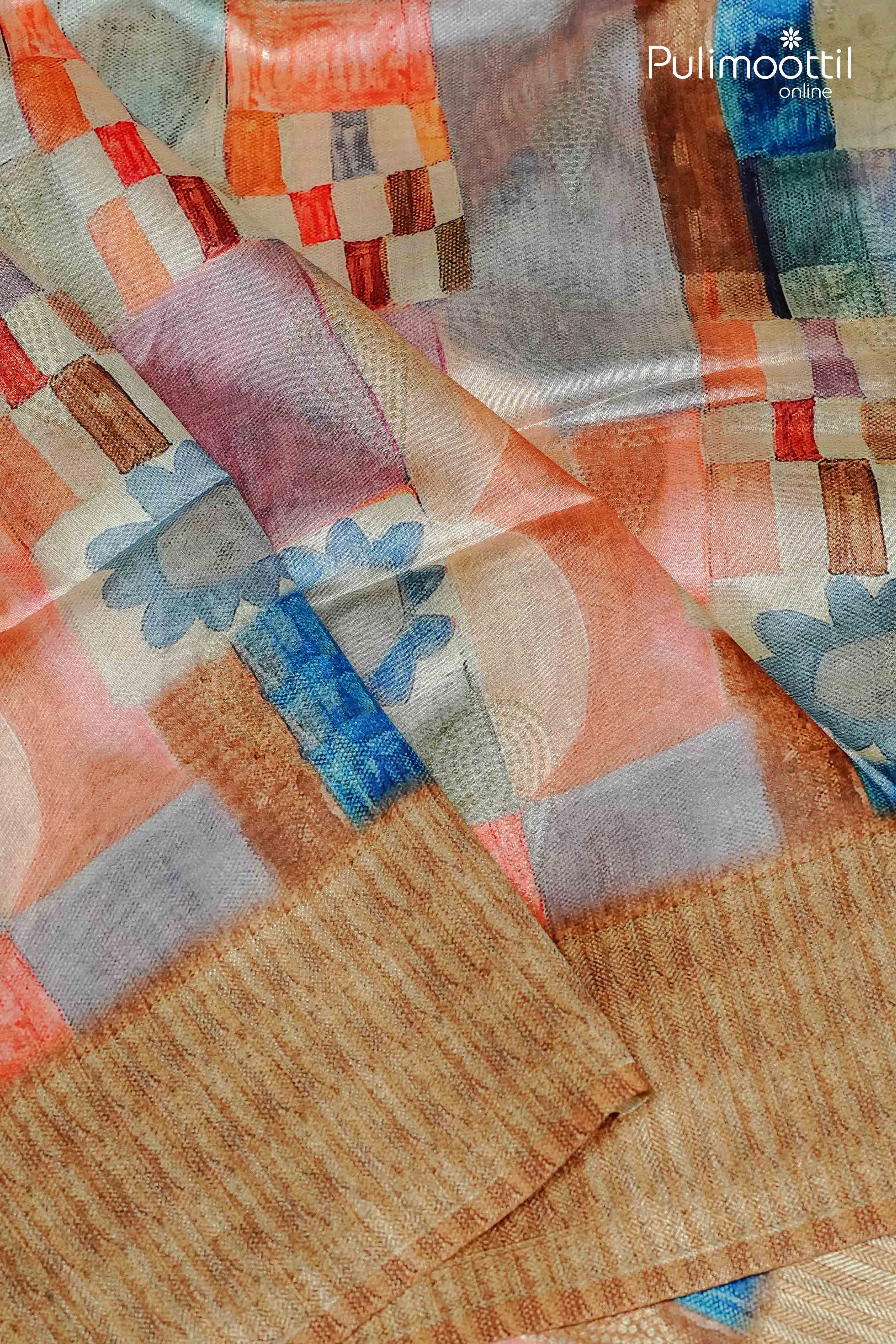 Detailed view of multi colour semi jute saree with floral and checkered abstract print in pastel shades, paired with golden woven fabric edge.