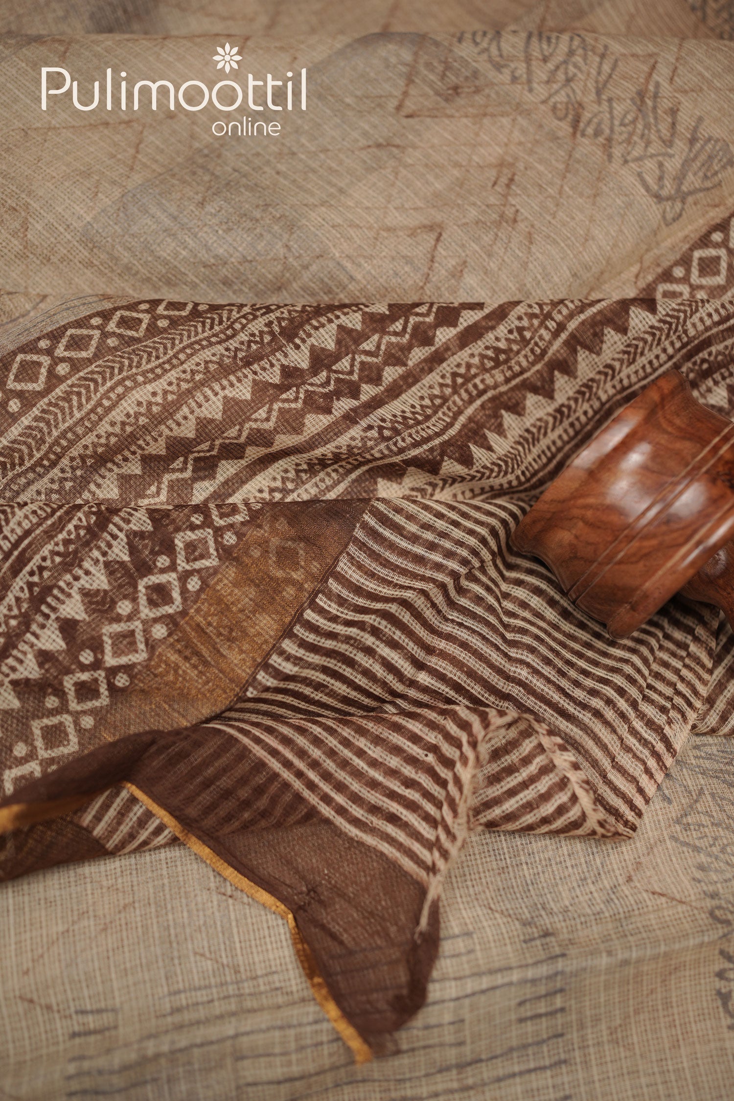 Detailed view of multi-shaded soft net-cotton saree with a combination of zigzag and line geometric patterns, golden thin border enhancing its look.