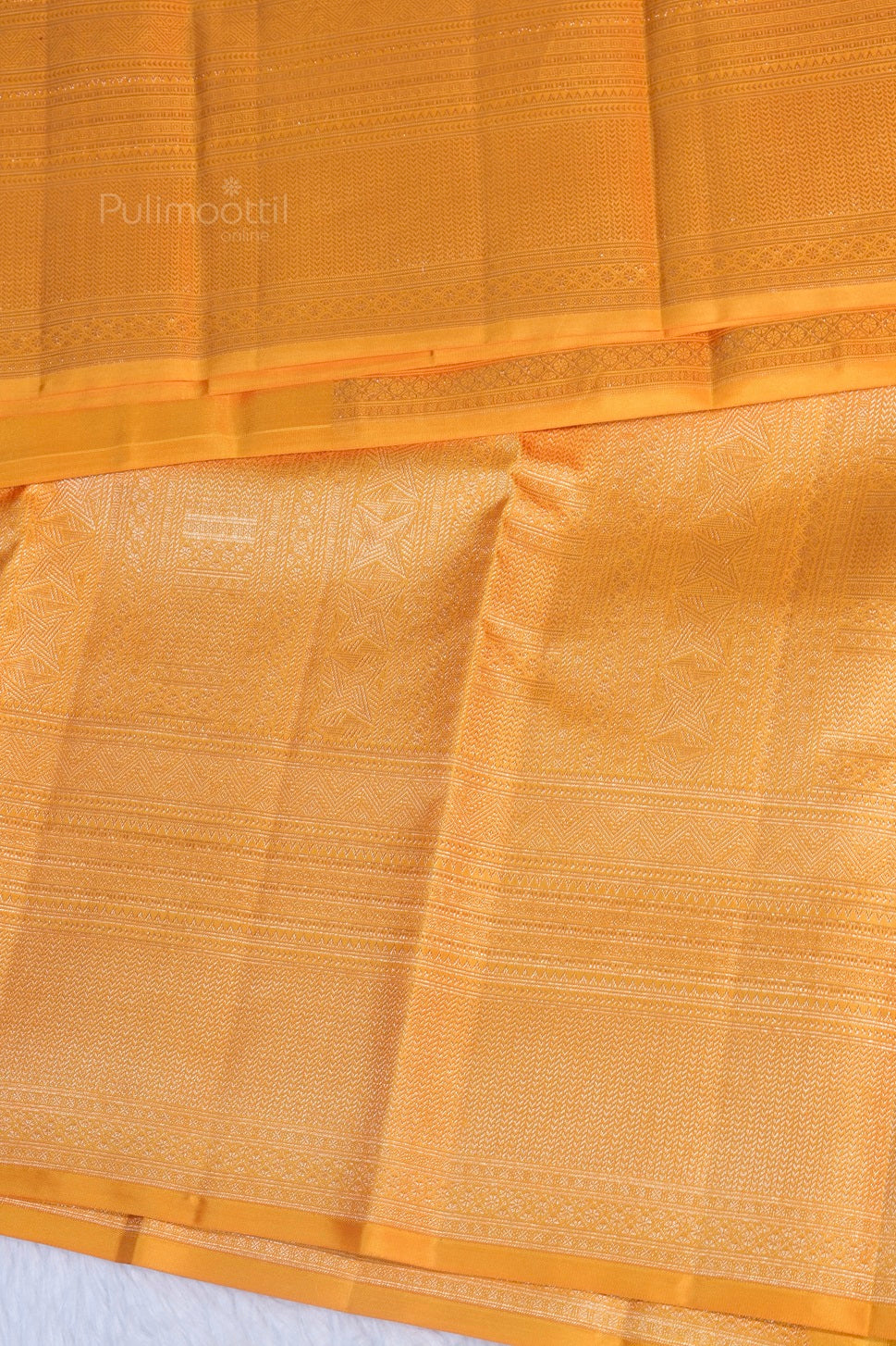 Luxurious silk texture of pure Kanchipuram bridal saree in mustard yellow