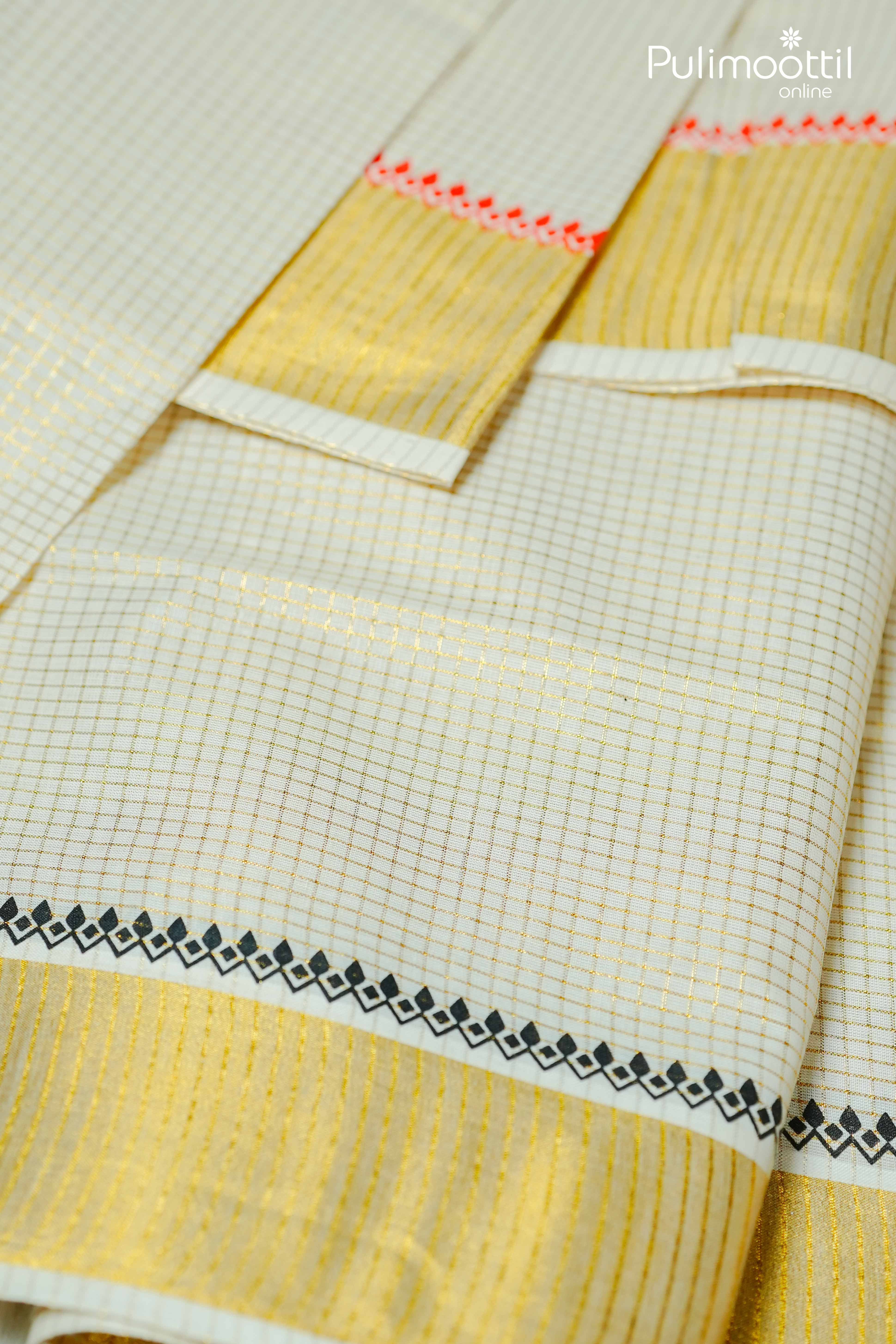 Kerala kasavu saree pleats with golden zari border and black temple design detailing