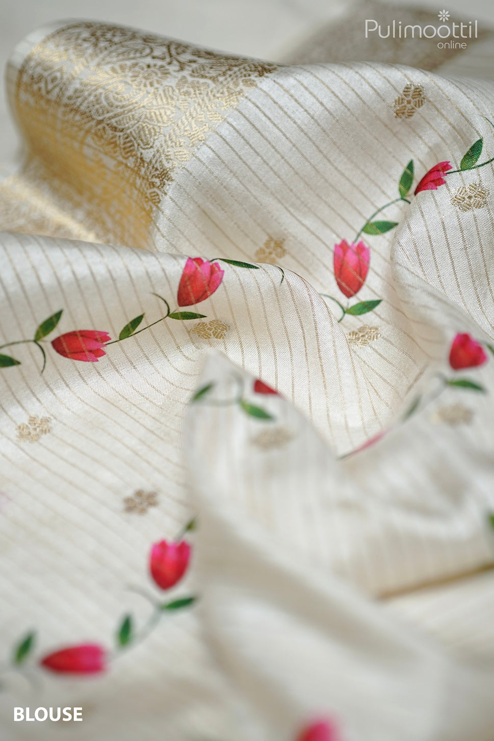 Close-up of off white semi tissue silk blouse fabric with golden zari stripes, floral print motifs, and antique zari border design.
