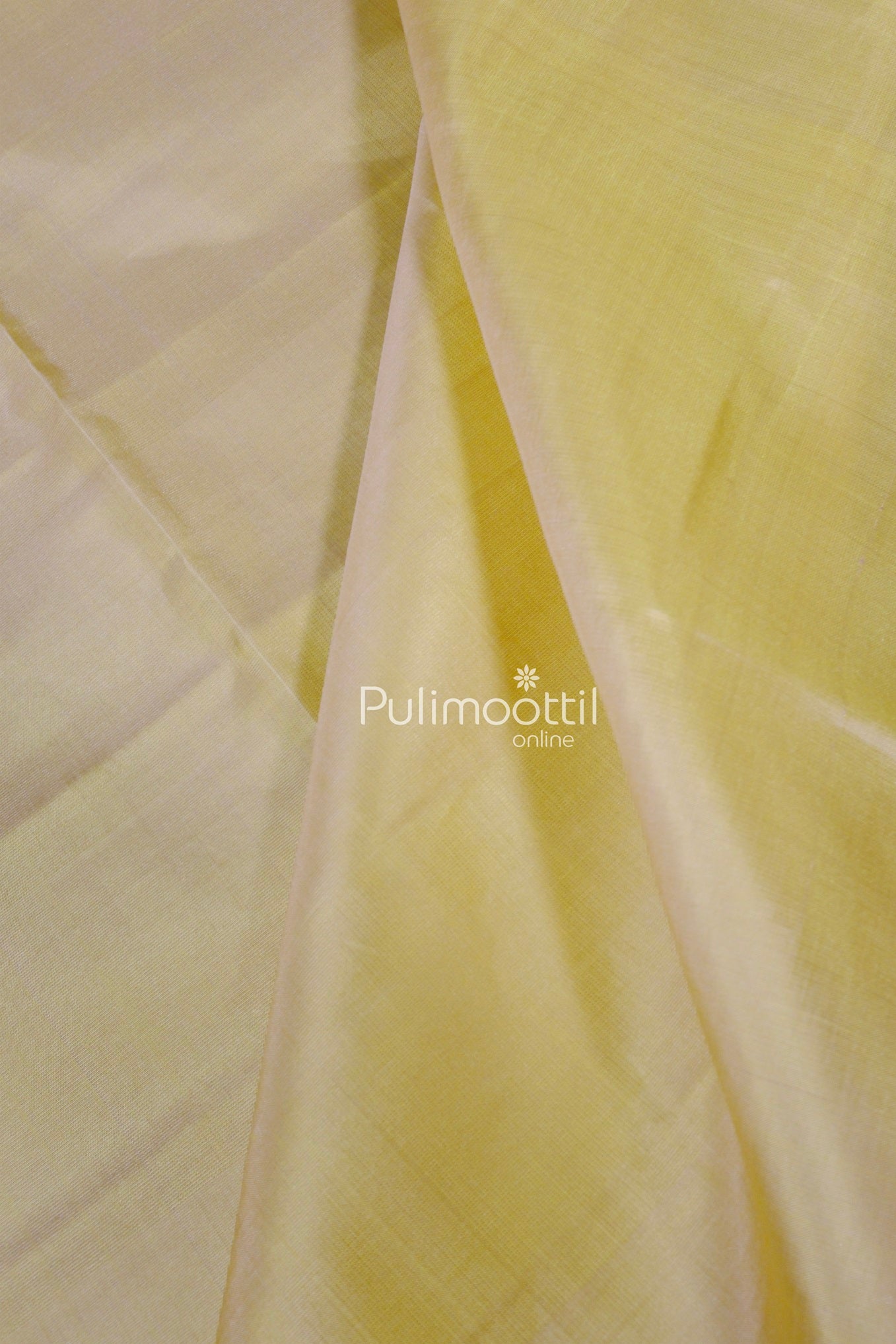 Close-up of the yellow pallu of a pure Kanchipuram silk saree from Pulimoottil, showing smooth texture and elegant weave.
