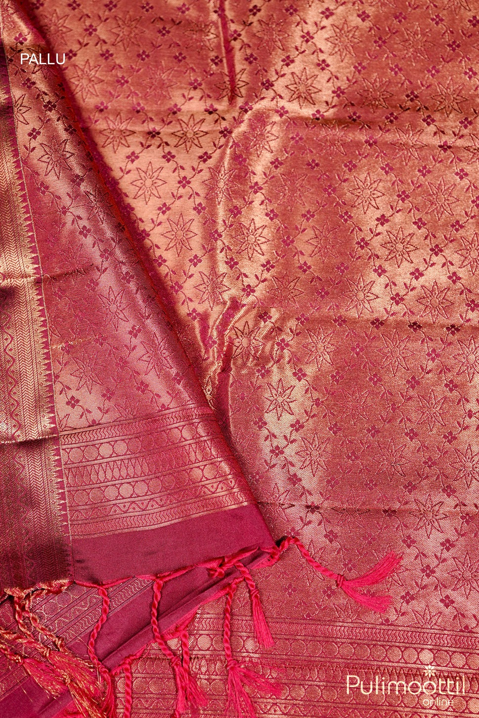 Pink saree with intricate patterns and a Pallu, featuring the brand 'Pulimoottil'.