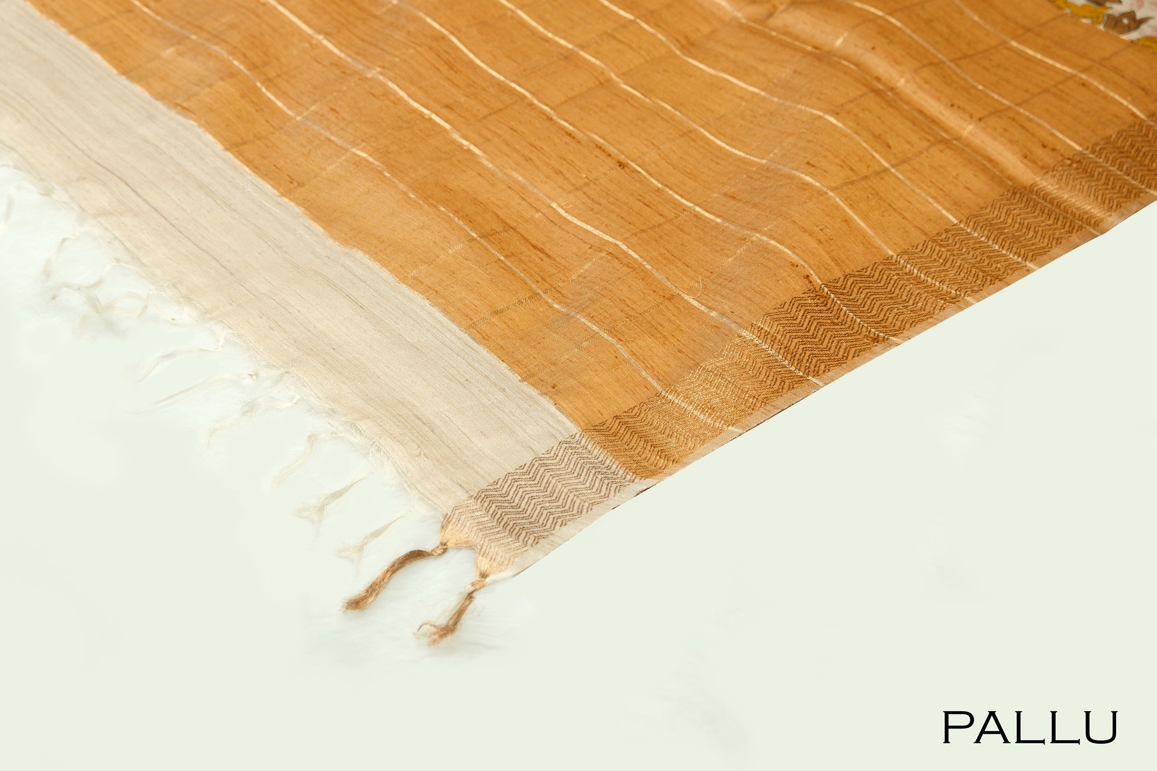 Beige color floral printed jute silk saree.