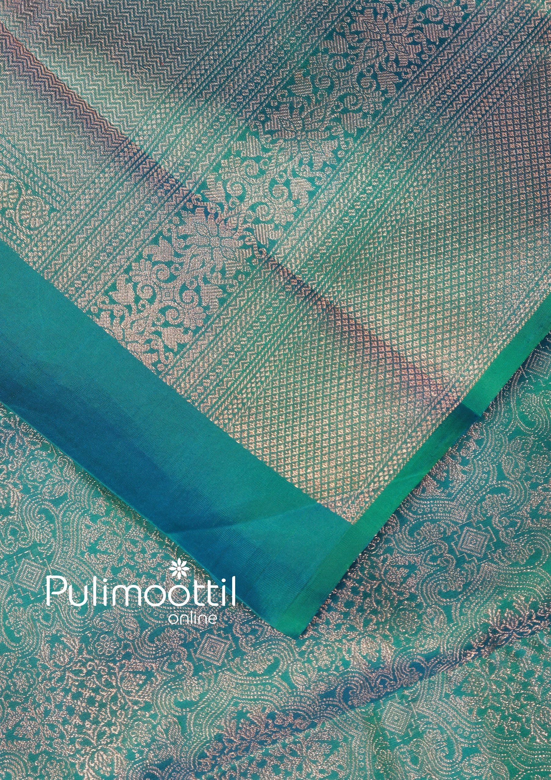 Elegant full view of peacock green Kanchipuram silk saree with broad silver border, designed for brides embracing classic South Indian wedding wear.