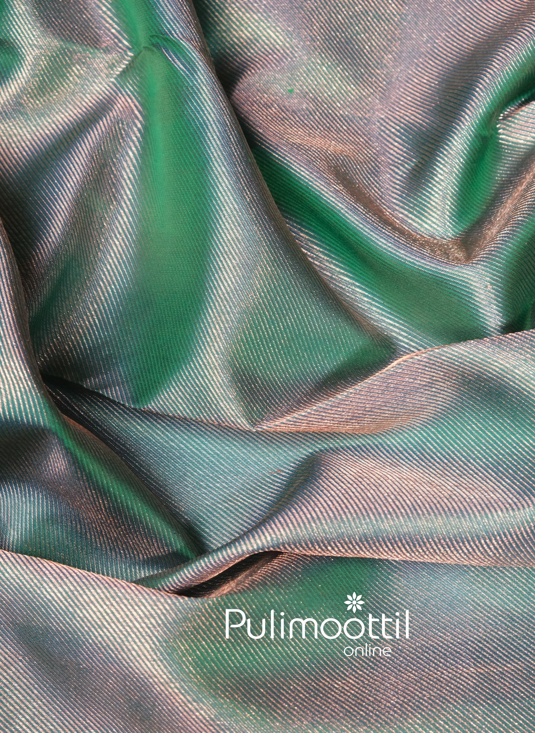 Close-up of soft and lustrous peacock green silk with rich zari weave, making this Kanchipuram saree ideal for brides and festive ethnic occasions.