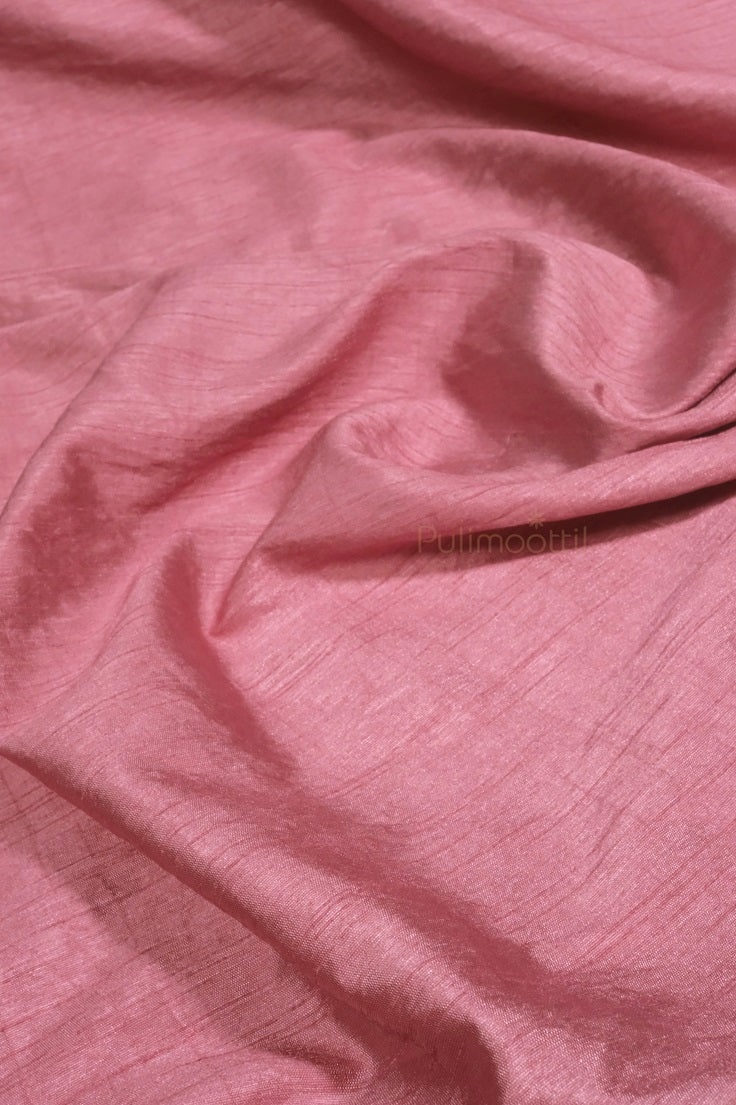 Full view of pastel pink organza saree styled for a formal event, paired with matching blouse