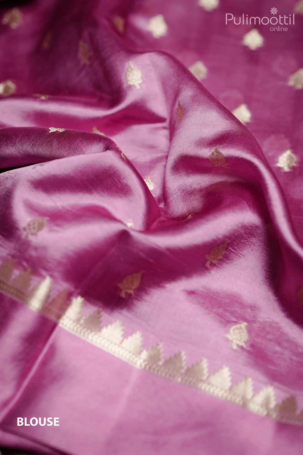 Golden blouse piece with bottas and satin border, matching purple mango silk saree fabric.