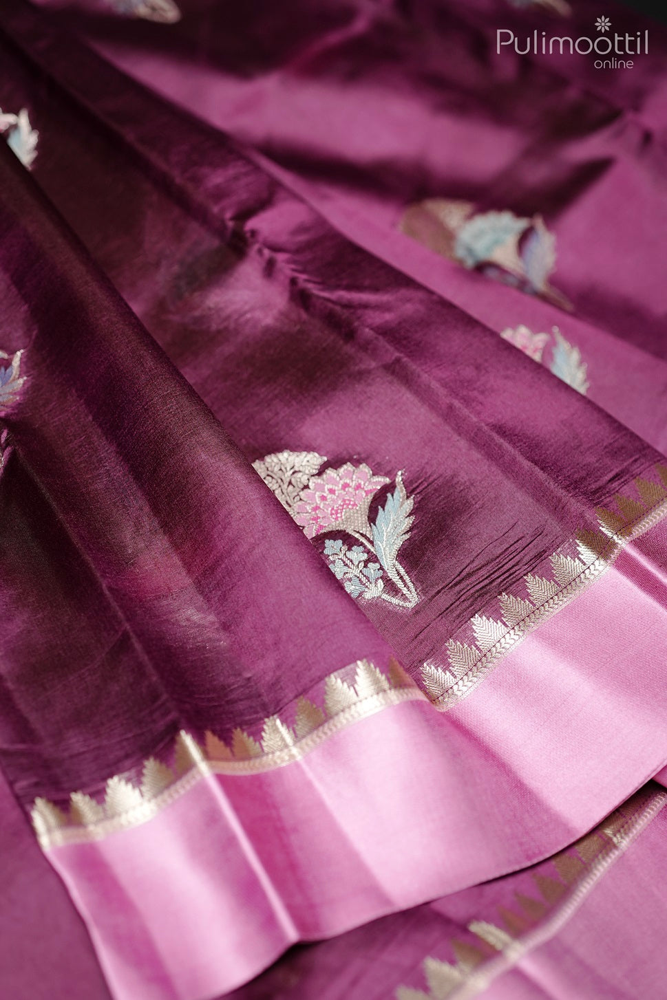 Purple mango silk saree with golden thread work floral motifs and satin border in close-up view.