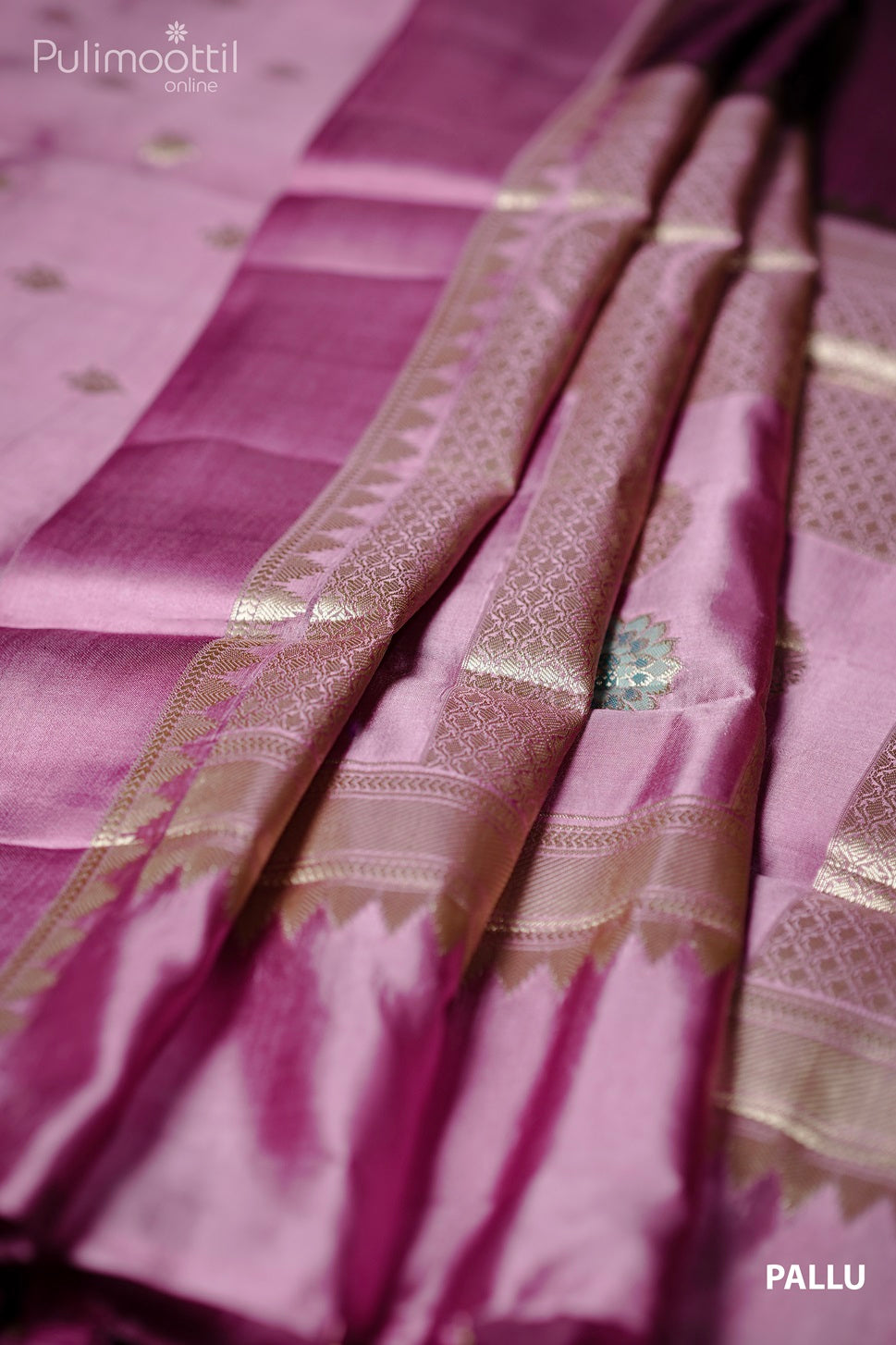 Pleated golden zari designer pallu of purple mango silk saree with satin border.