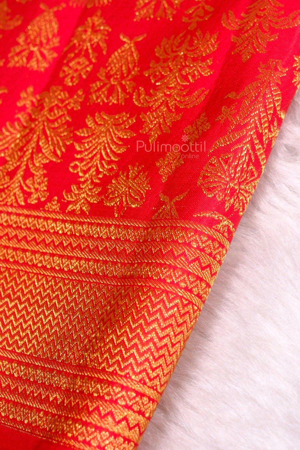 Golden zari border edge of mustard Kanchipuram wedding saree detailed weave