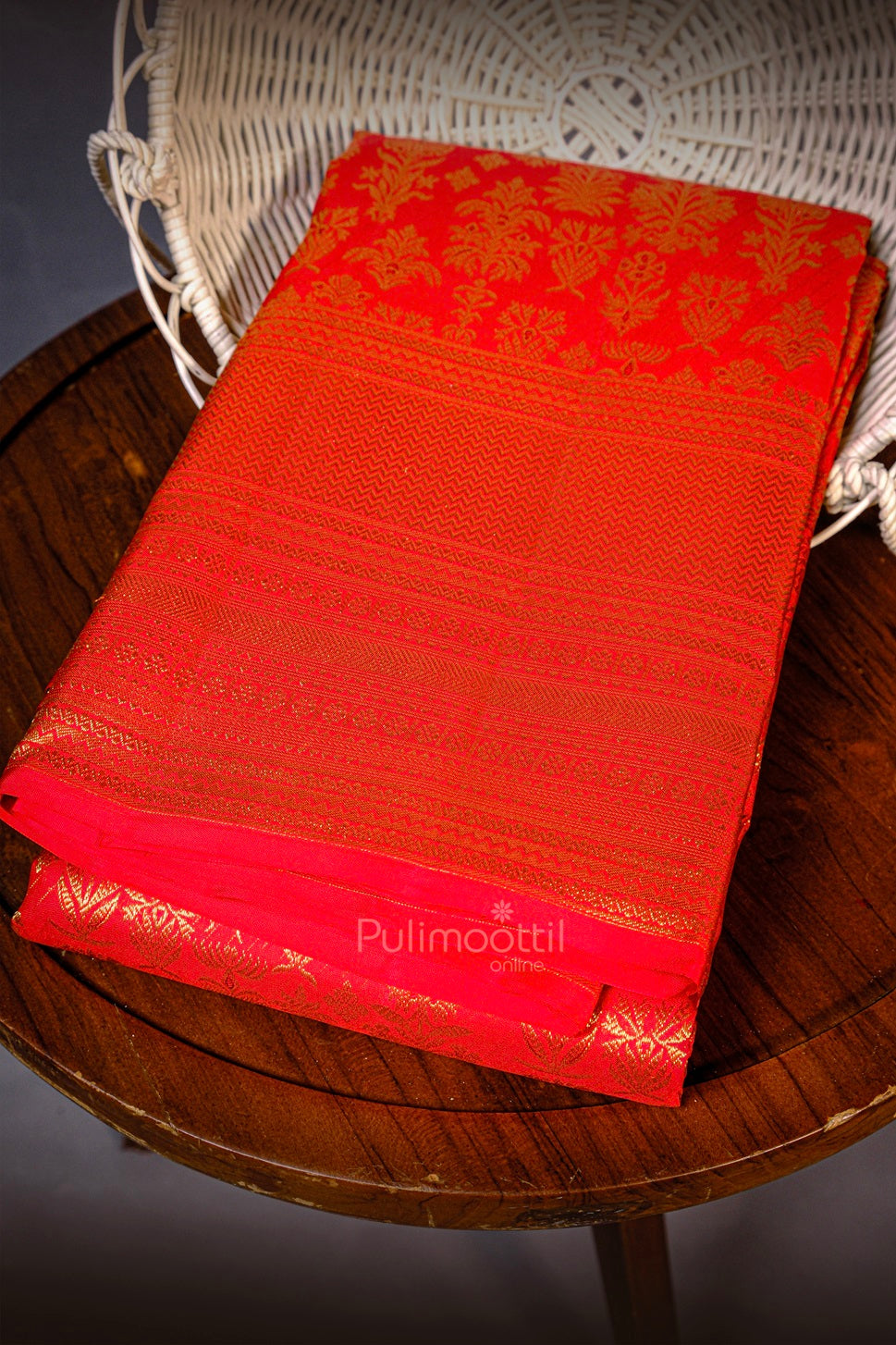 Mustard yellow pure Kanchipuram bridal saree neatly folded showing woven gold zari patterns