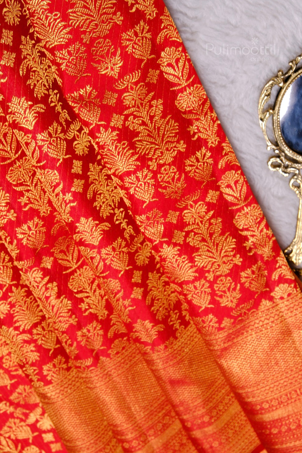 Close-up of mustard silk saree body with intricate self-governing zari texture