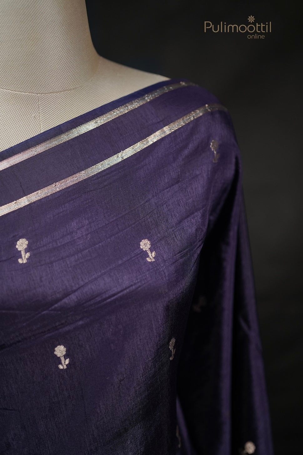 Shoulder close-up of dark violet Chiniya silk saree with golden floral buttas, highlighting the luxurious texture for party wear or bridal saree.
