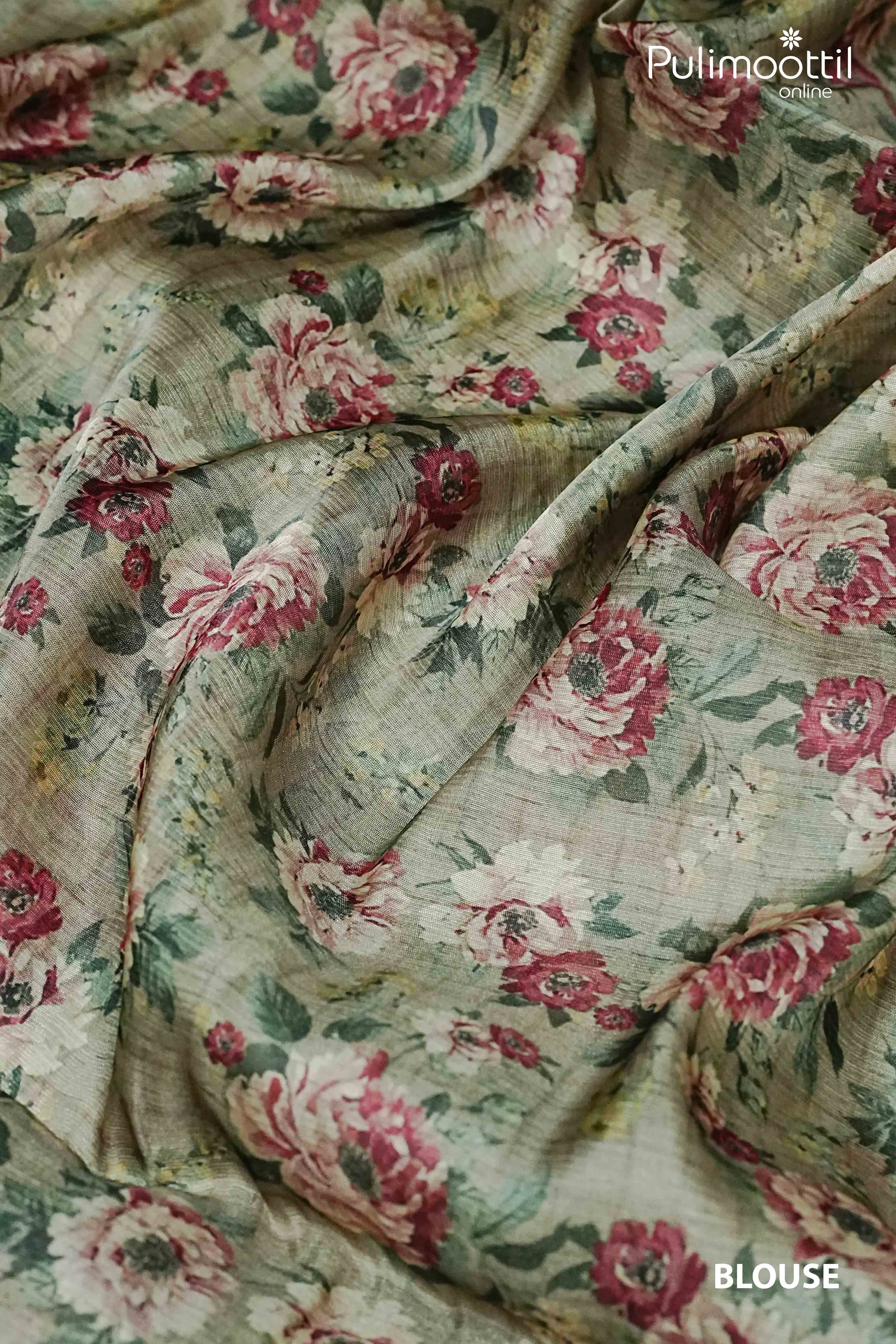 Behr green floral printed organza blouse piece with vintage rose design, perfectly paired with festive sarees for Onam elegance.