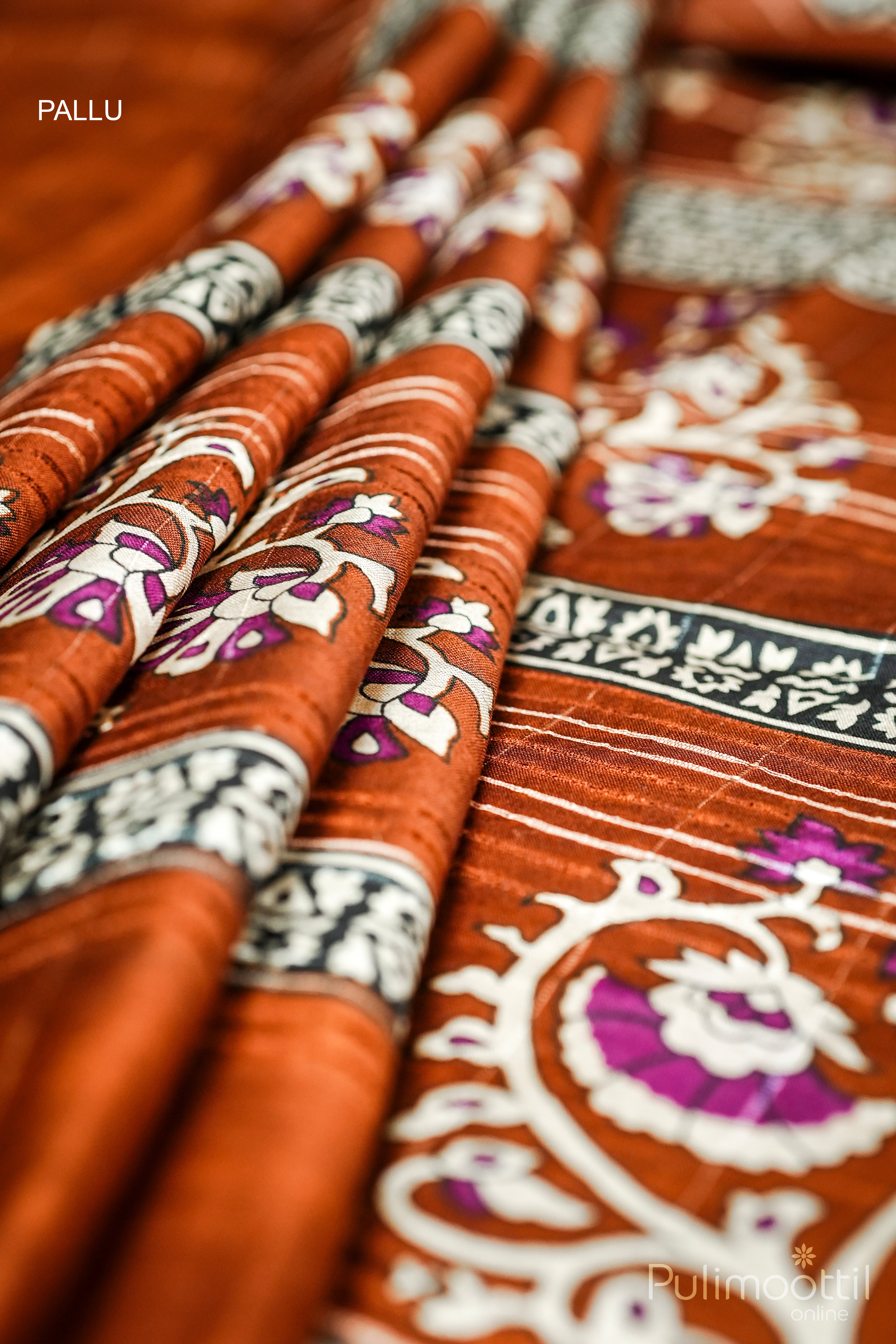 Semi Tussar saree pallu with floral printed design and tasseled edge, displayed in four pleats – Pulimoottil Silks