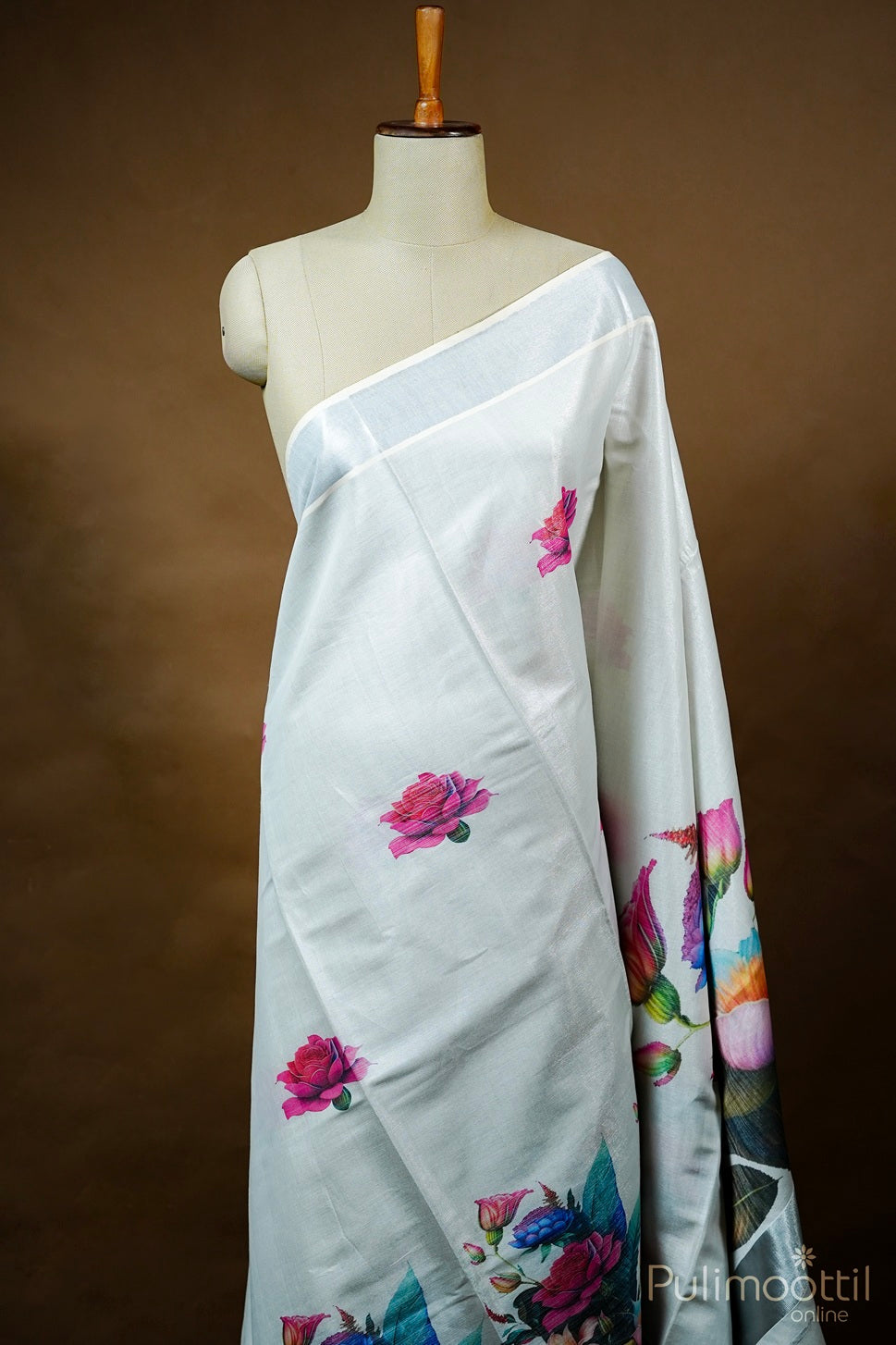 Silver Tissue Kerala Set Saree with multicolour floral design and shimmering silver tissue border, draped on mannequin