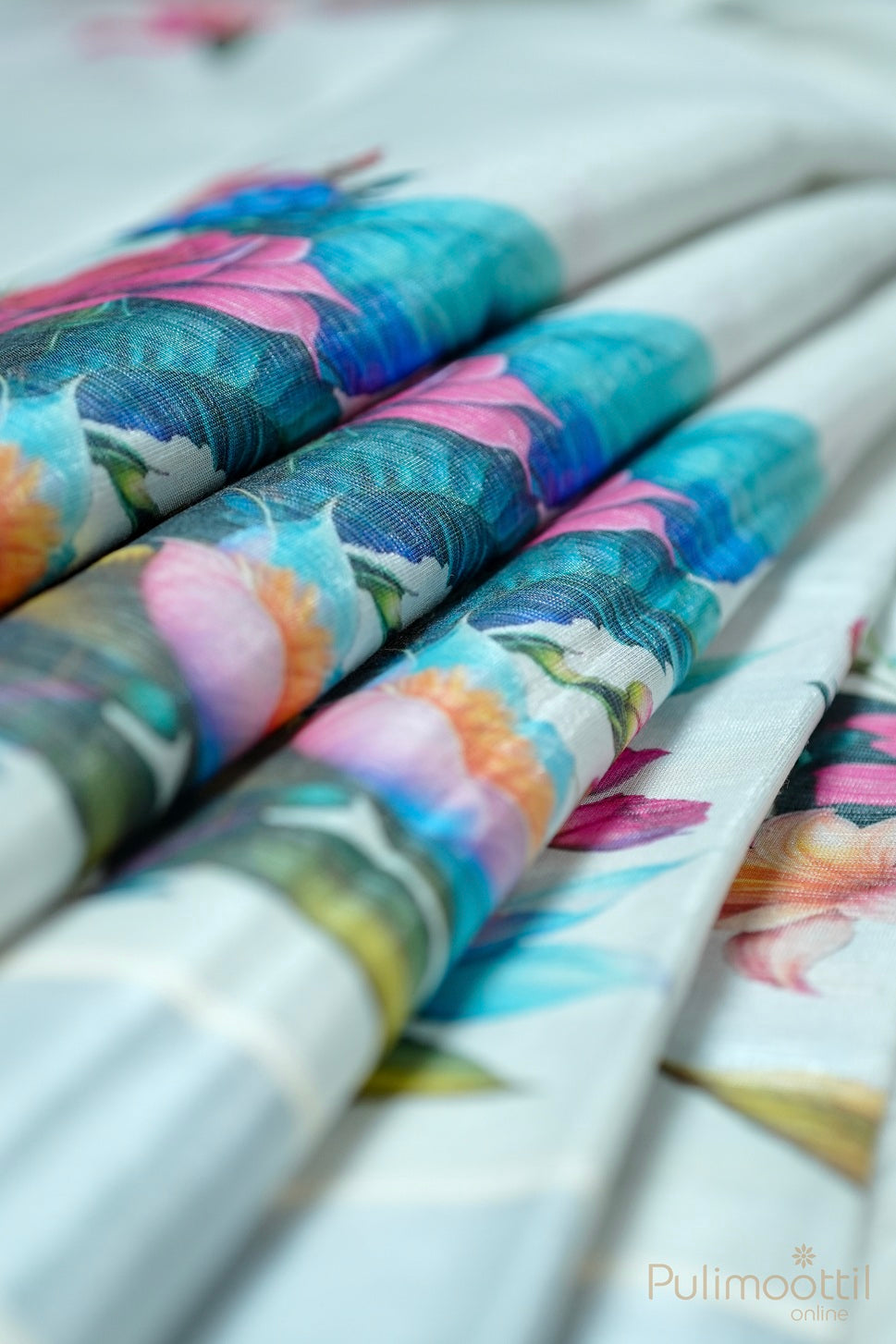 Colorful floral-patterned pens with a brand name on a white background