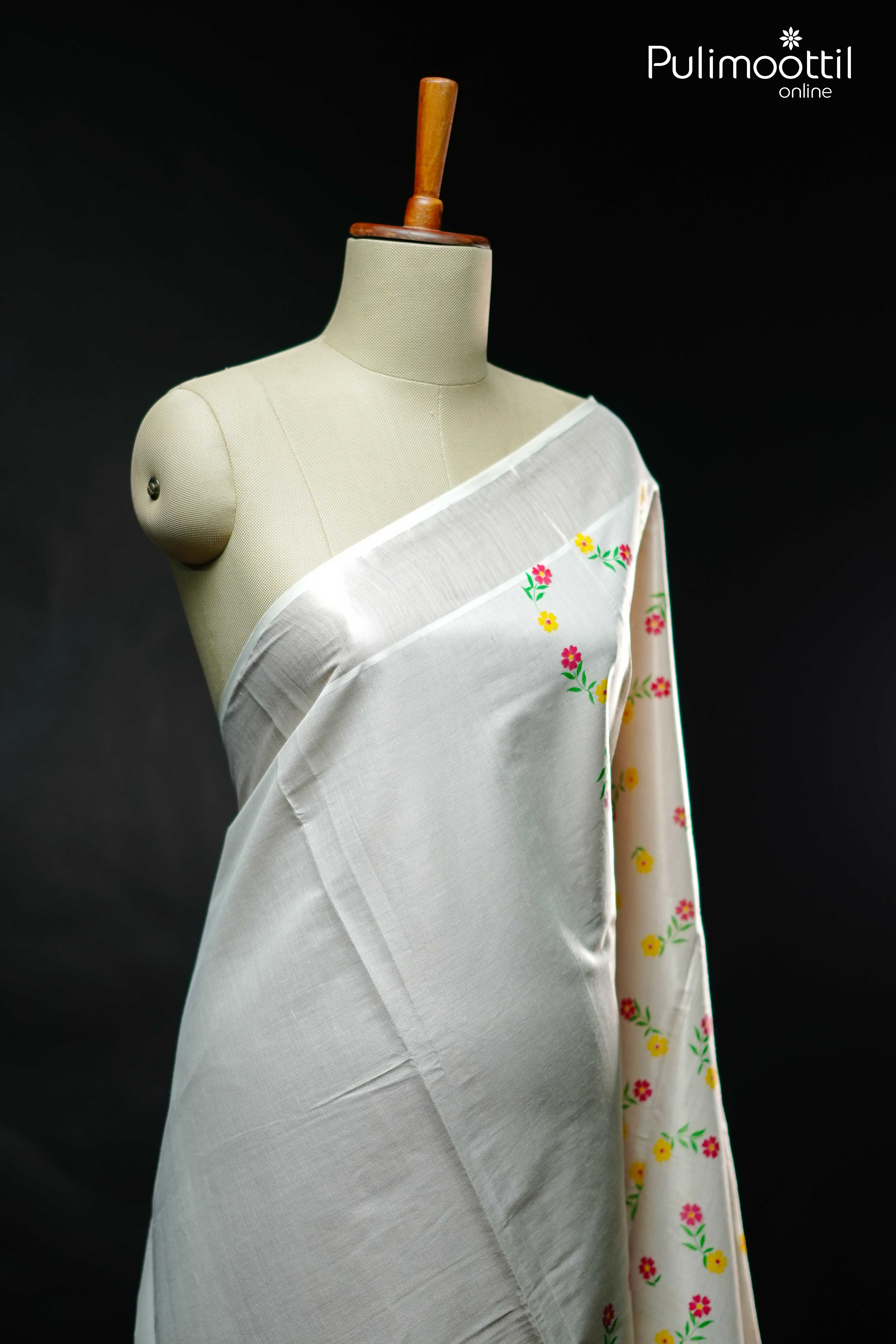 Elegant Kerala Onam saree in silver tissue with floral printed body and matching blouse piece