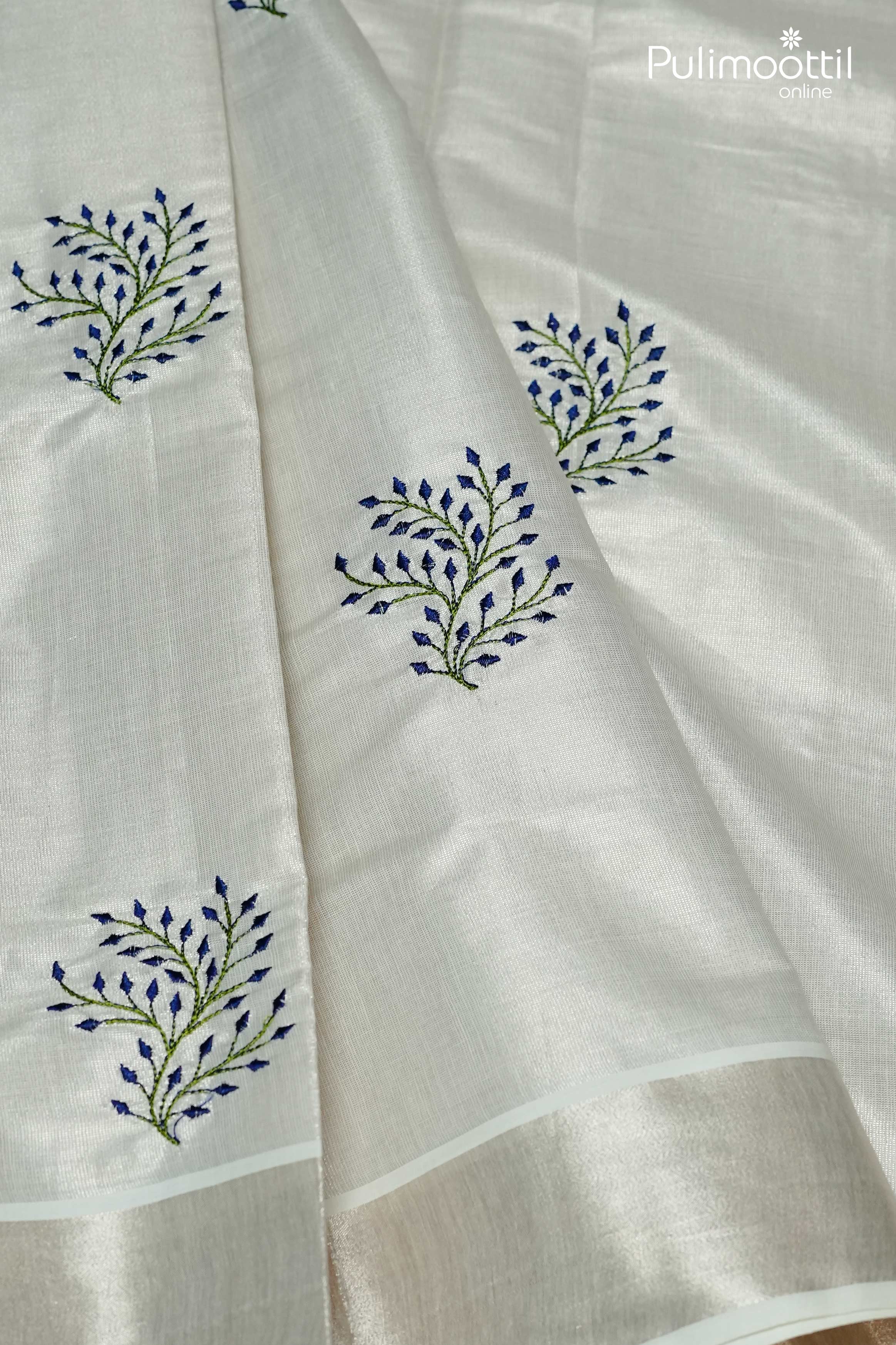 Elegant silver tissue Kerala Onam saree with delicate thread work on body