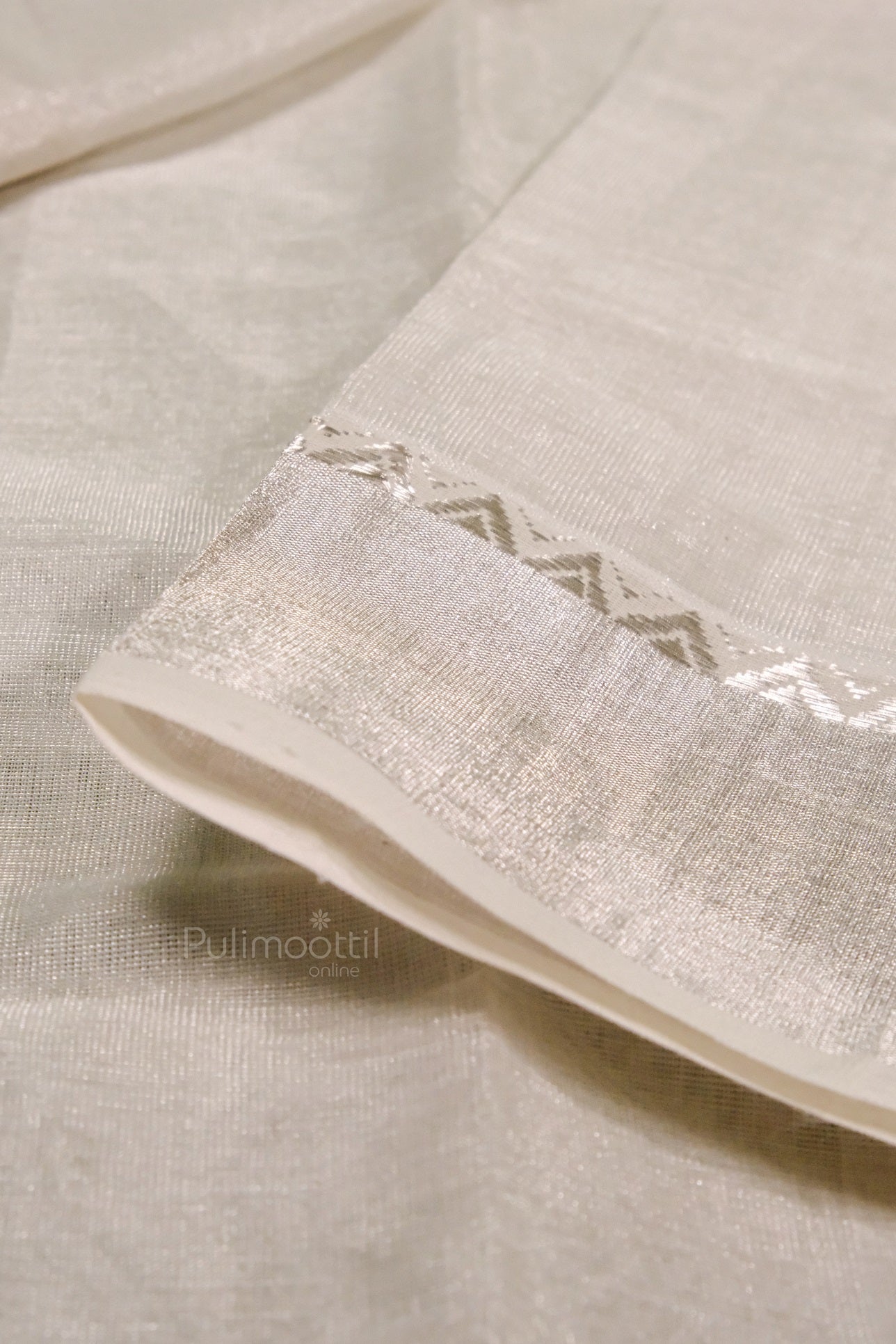 Detailed view of pure cotton handloom Kerala saree blouse piece with silver border and soft texture and fine weave