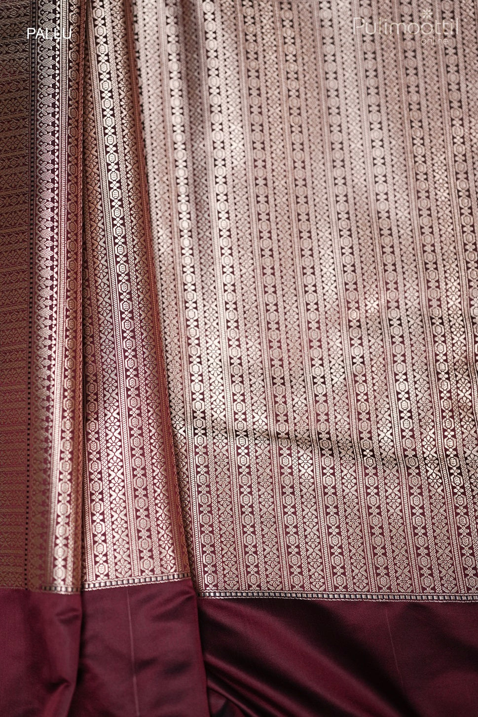 Detailed view of designer striped pallu with tassels on maroon Mashru silk Banarasi saree, perfect for wedding saree and bridal saree occasions.