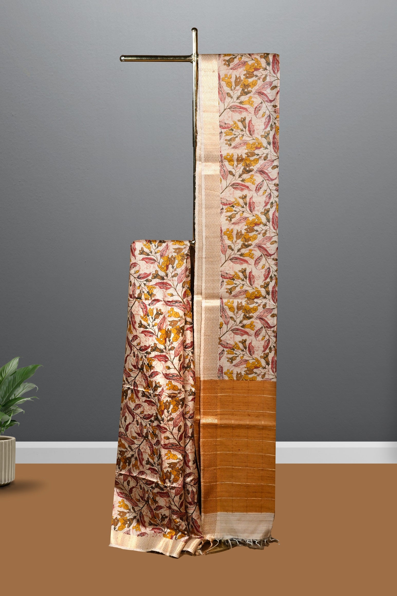 Beige color floral printed  jute silk saree.