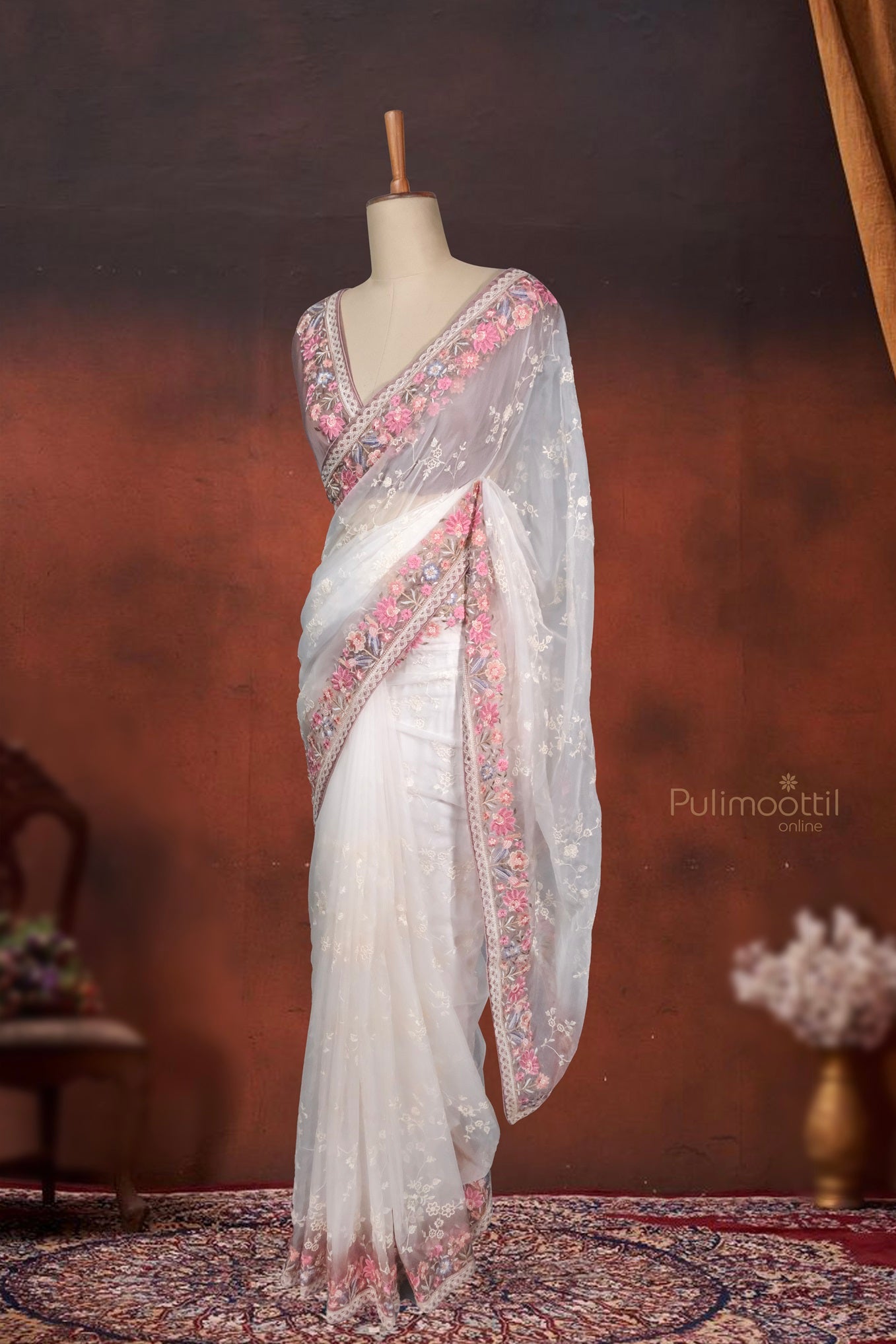 A back pose showcasing the sheer organza texture layered gracefully. The translucent look paired with minimalist embroidery creates a dreamy and feminine aura. Ideal for bridal showers, mehendi ceremonies, or intimate soirées.
