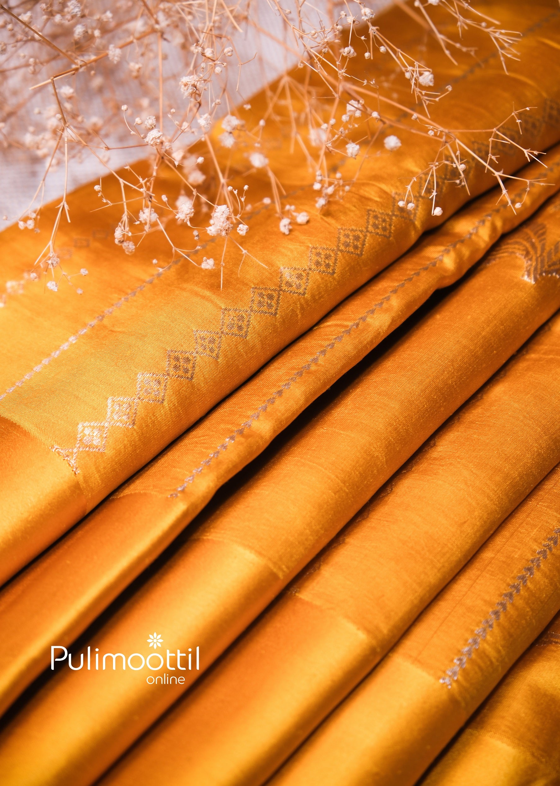 Yellow mango silk saree with elegant silver zari detailing, suitable for bride’s Haldi function or wedding rituals