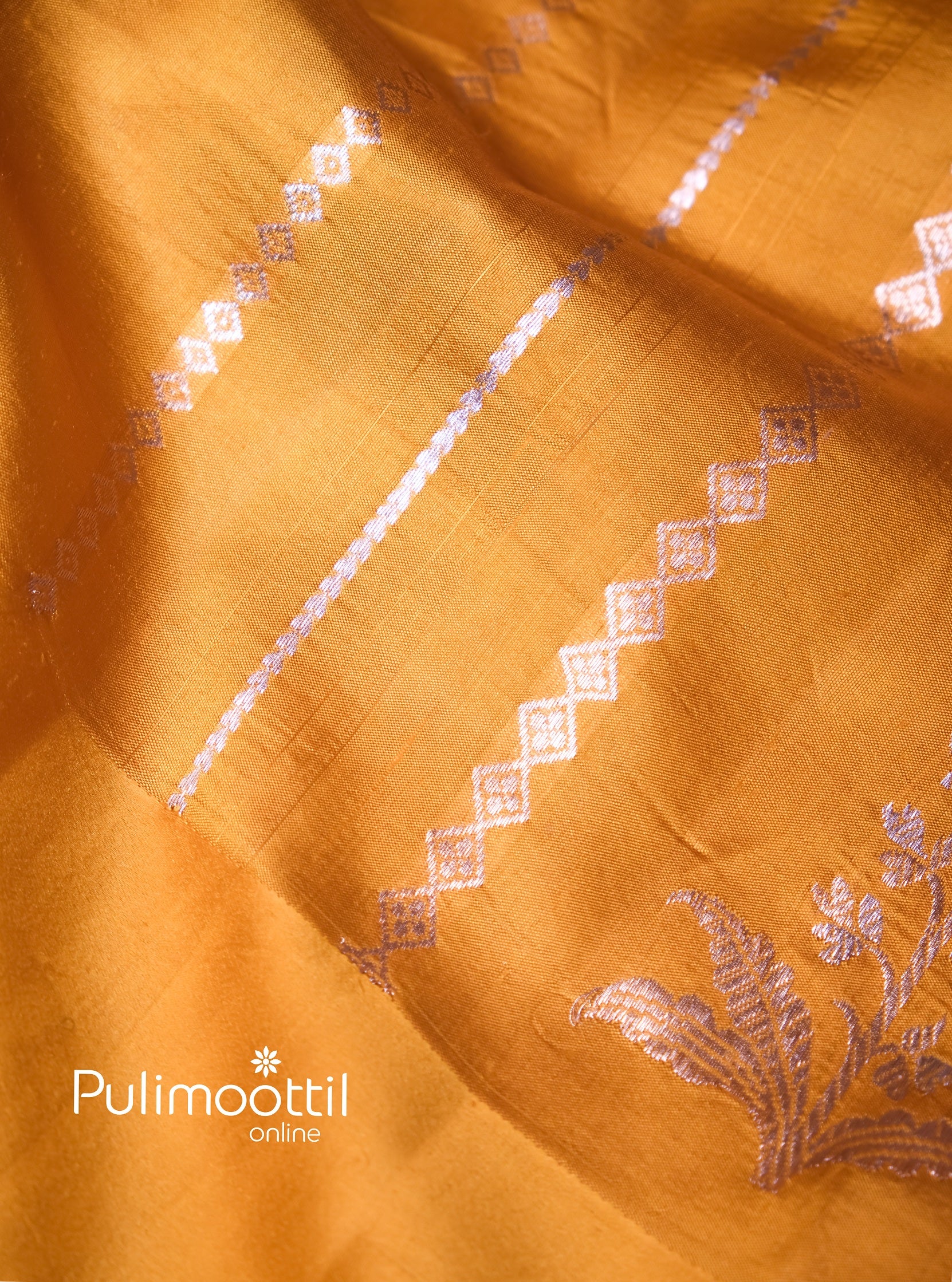 Yellow silk saree with silver motifs, perfect for bridal haldi function or pre-wedding celebration wear.