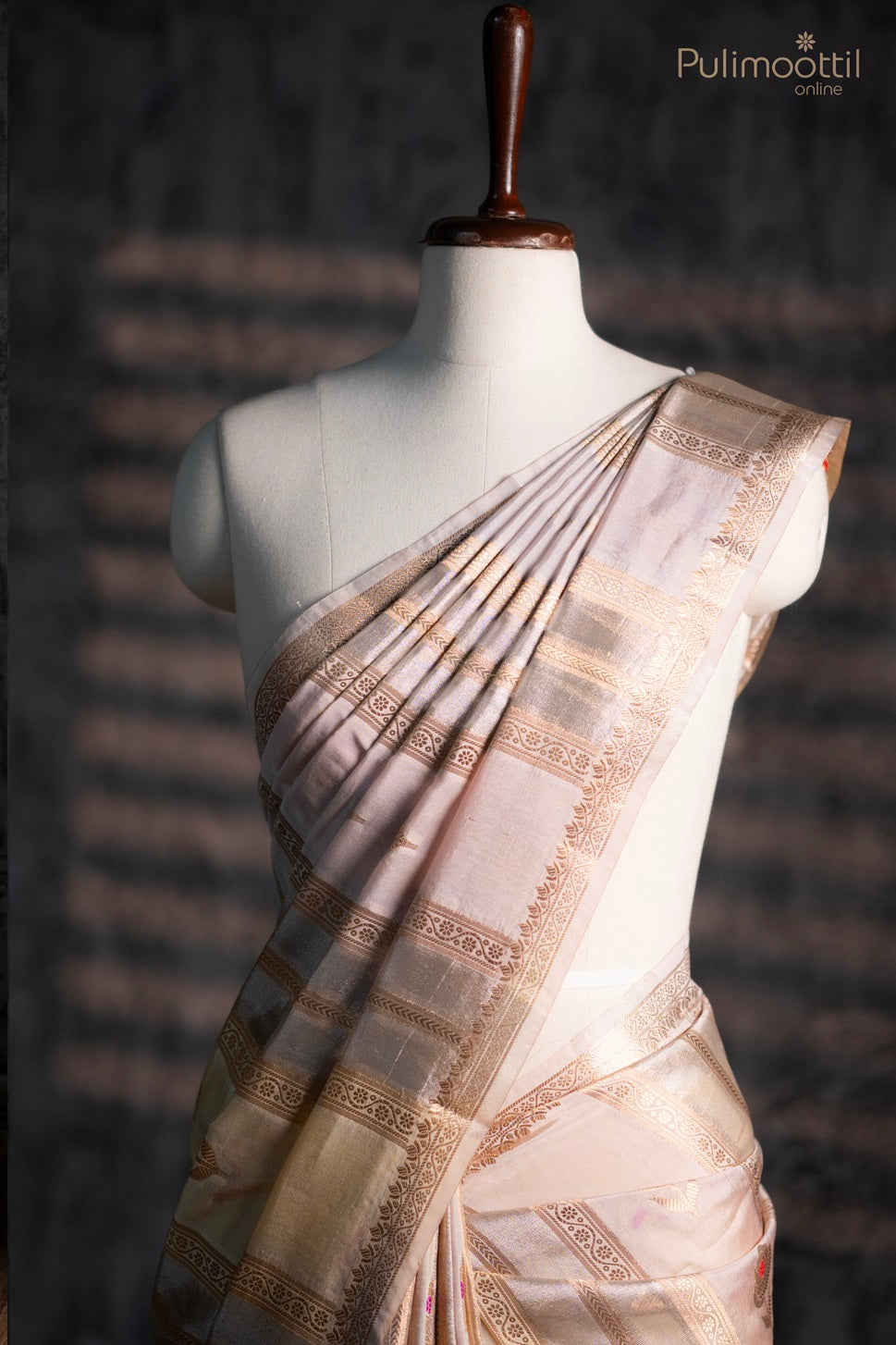 Bone cream colour organza saree.