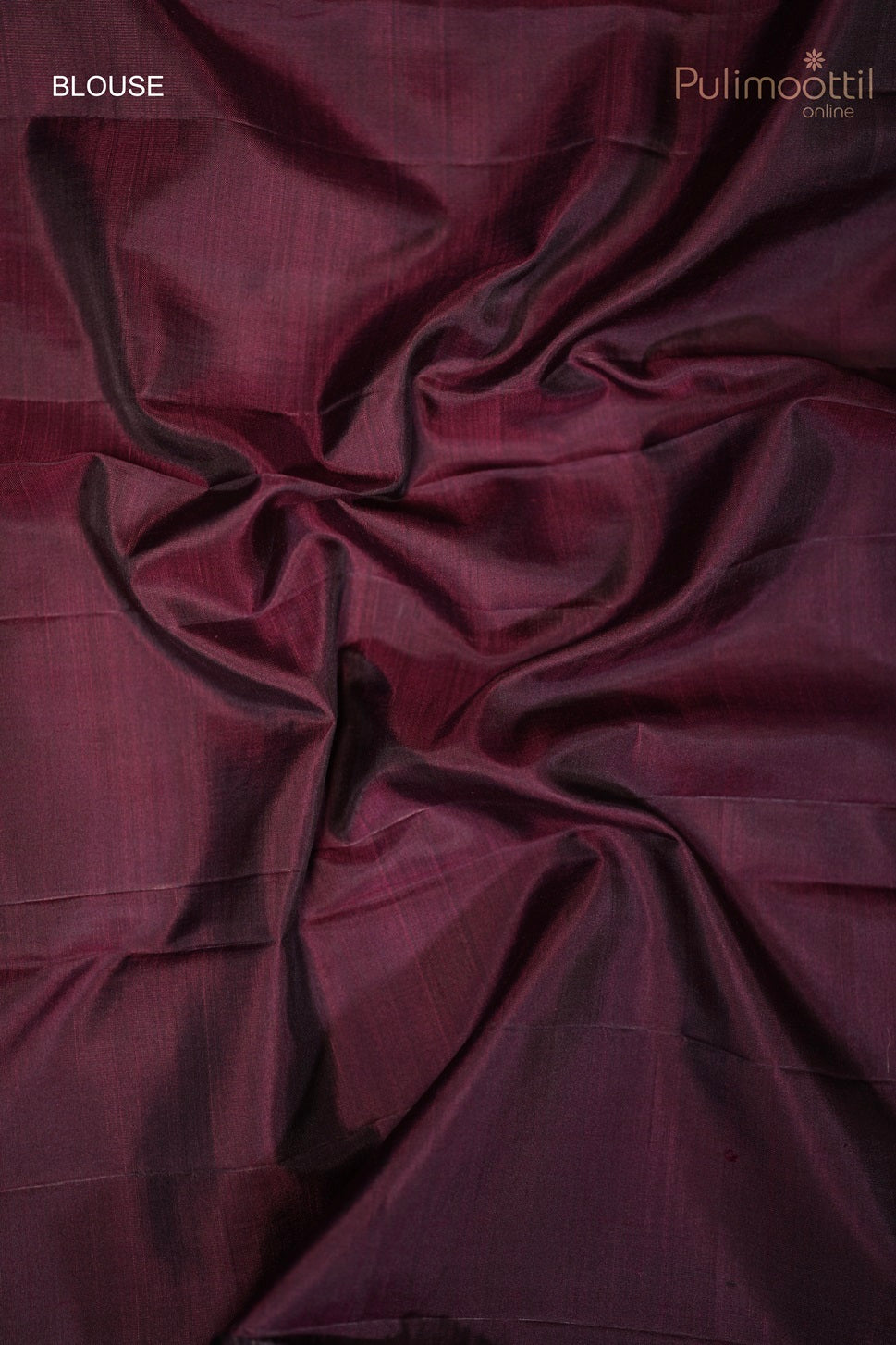 Close-up of the blouse fabric in dark purple with subtle floral buttas and stripes pattern.