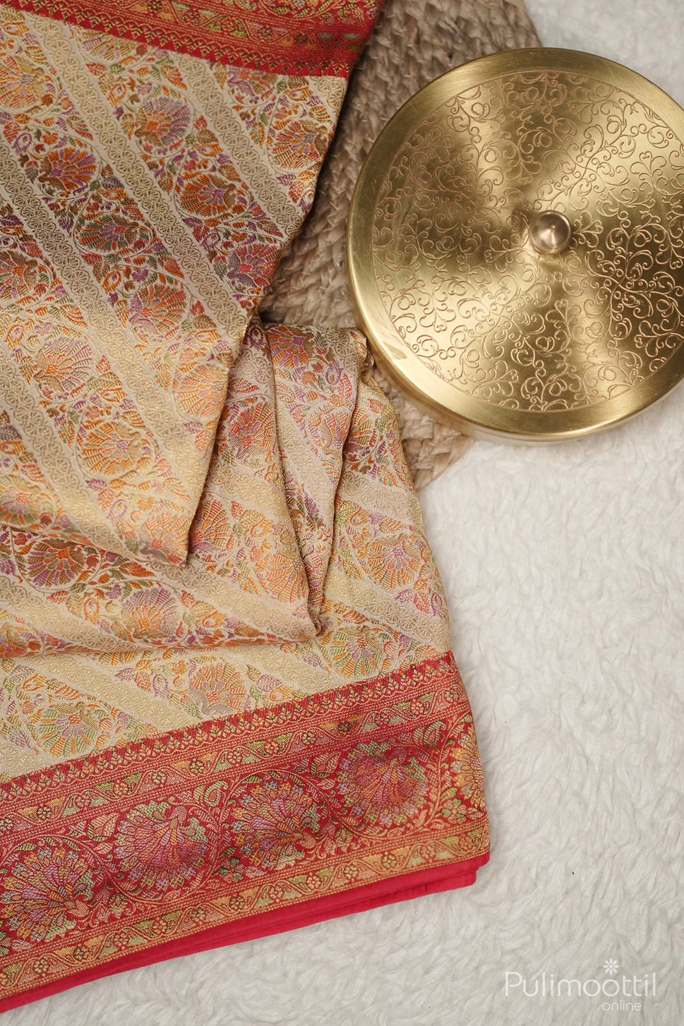 Close-up of vertical striped border on pastel multishaded organza fancy saree, showcasing golden buttas and elegant design for bridal and wedding sarees.