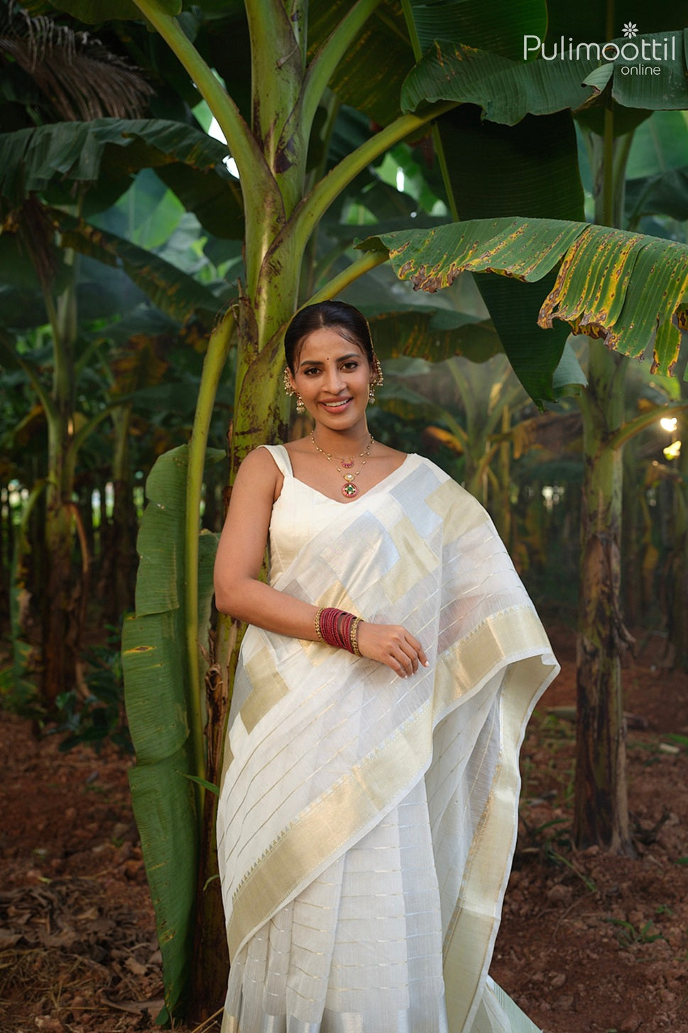 Offwhite color Kerala traditional Onam saree