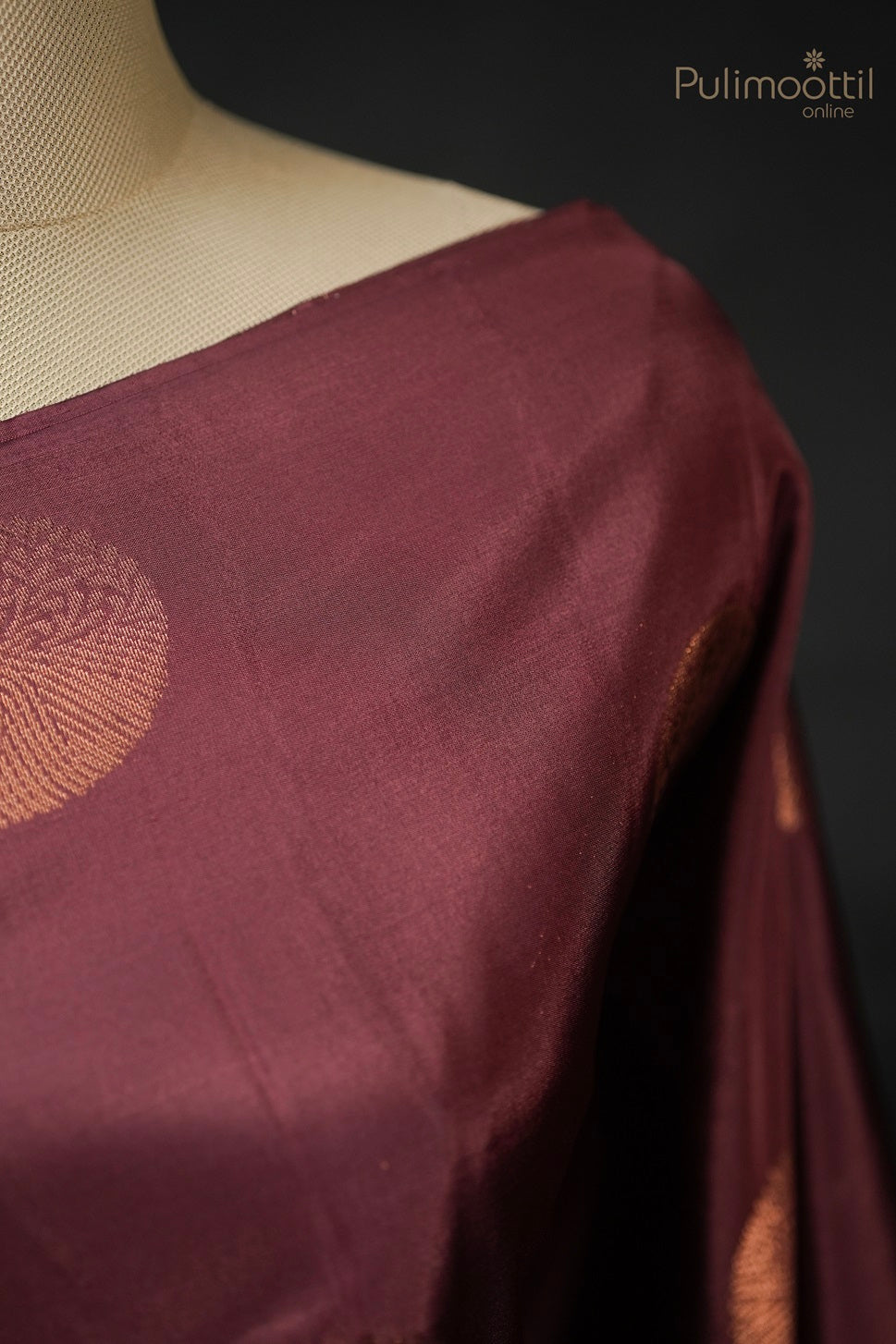 Detailed view of terracotta Kanchipuram saree with copper round buttas