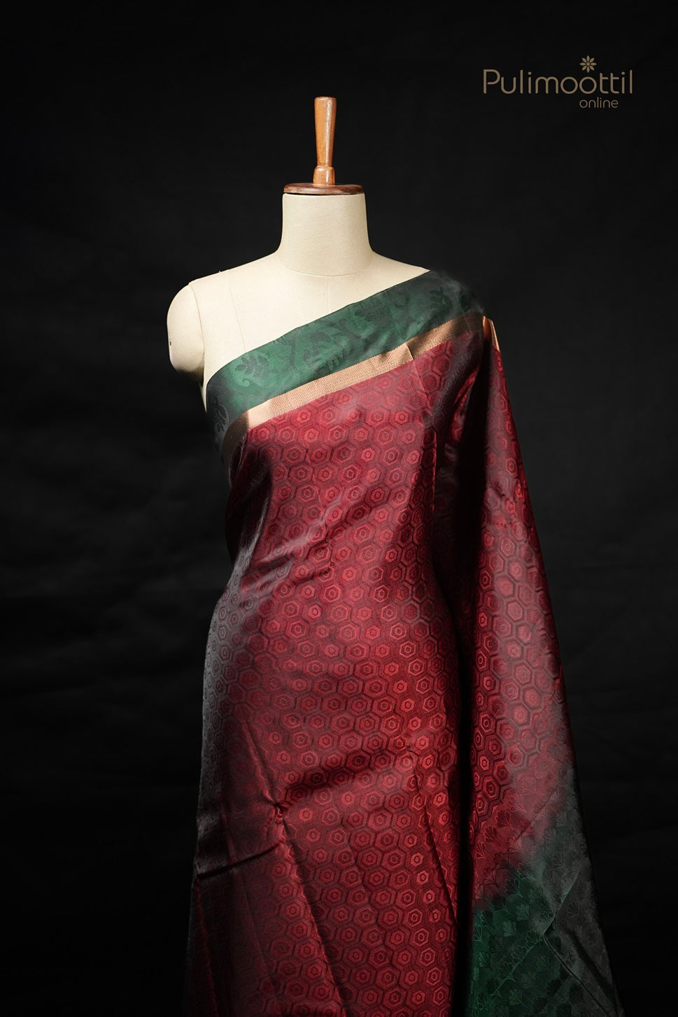 Maroon Kanchipuram silk saree with pentagon self-weave and double green border on mannequin